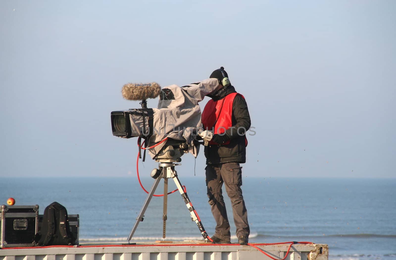 TV camera man filming a sports match