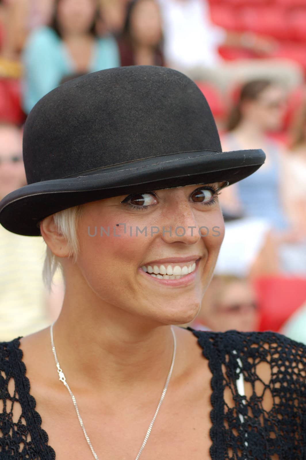 Breast Cancer survivor and campaigner Caroline Monk wearing a bowler hat at the Cartier Polo, Windsor.