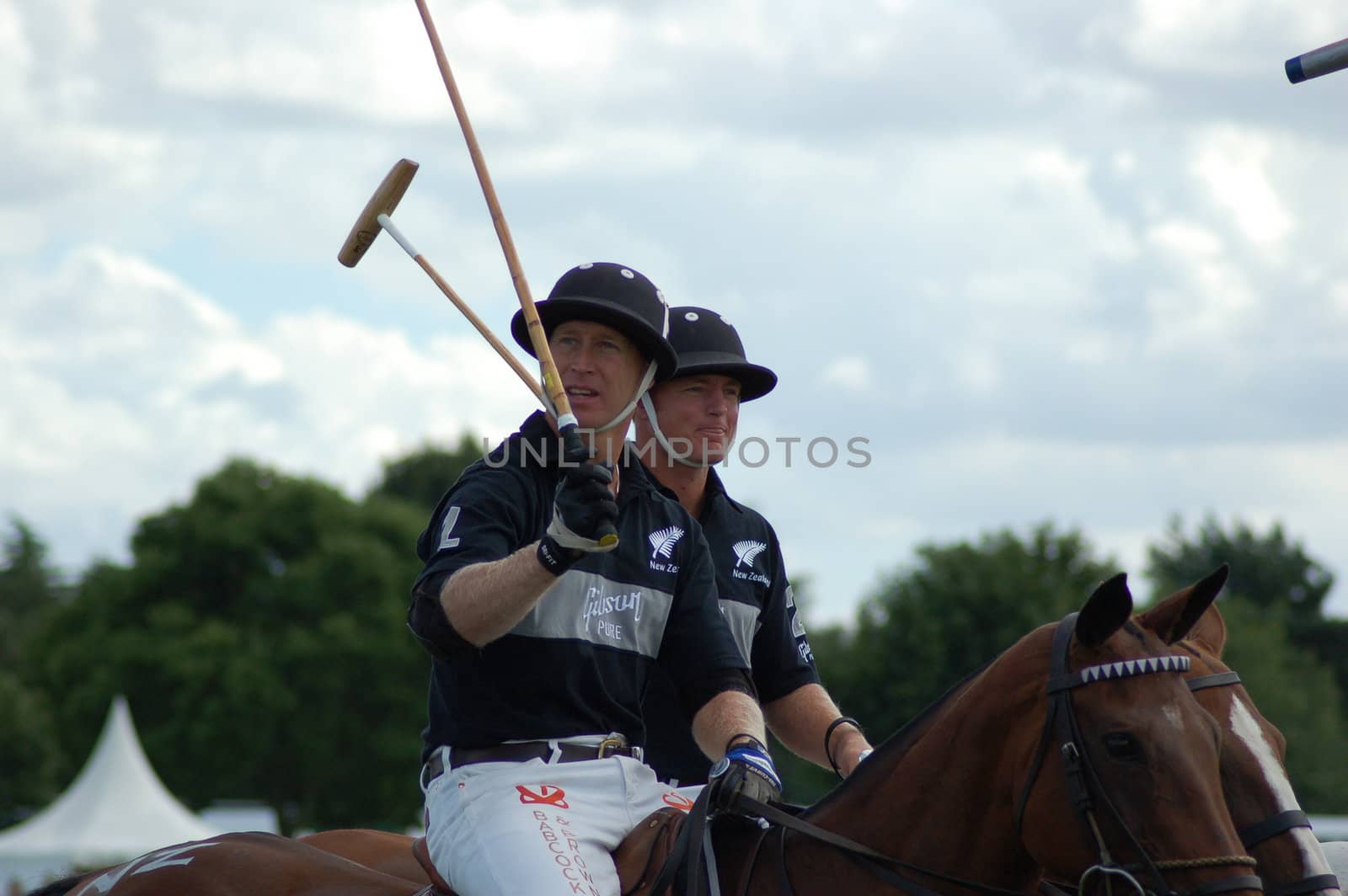 HRH Prince Charles mounted and playing polo  at the Cartier Polo, Windsor.