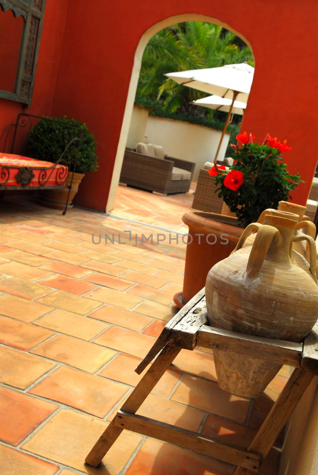 Courtyard of mediterranean villa in French Riviera. Shallow depths of filed, focus on amphoras.