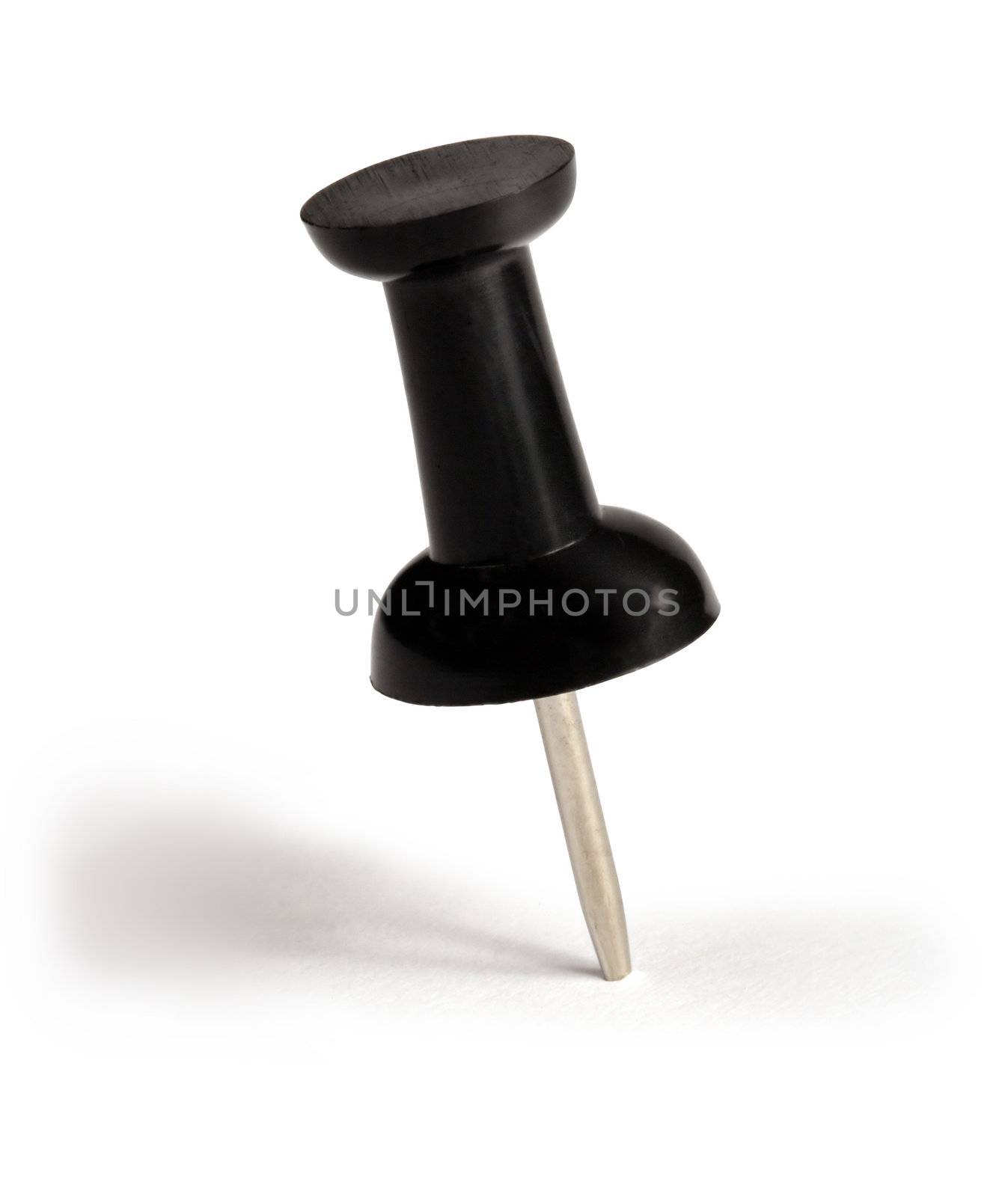 Macro image of a single black push-pin.
