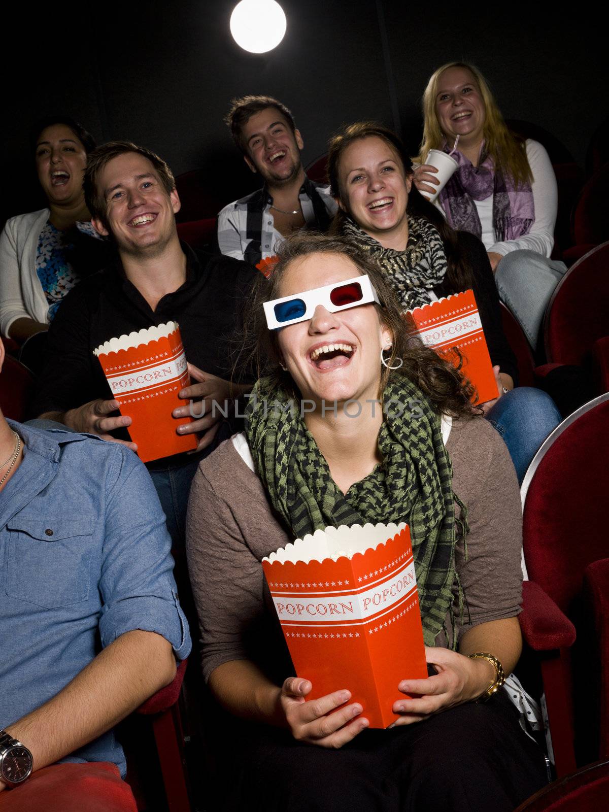 Laughing woman at the movie theater