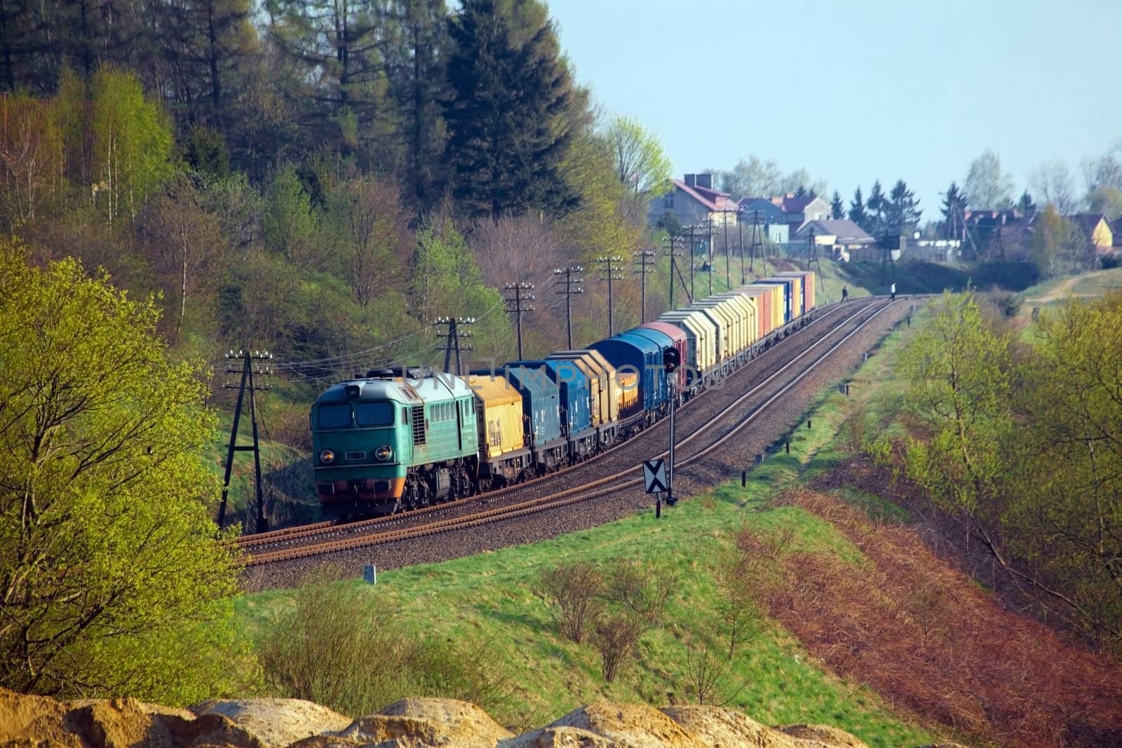 Freight train passing the hilly landscape
