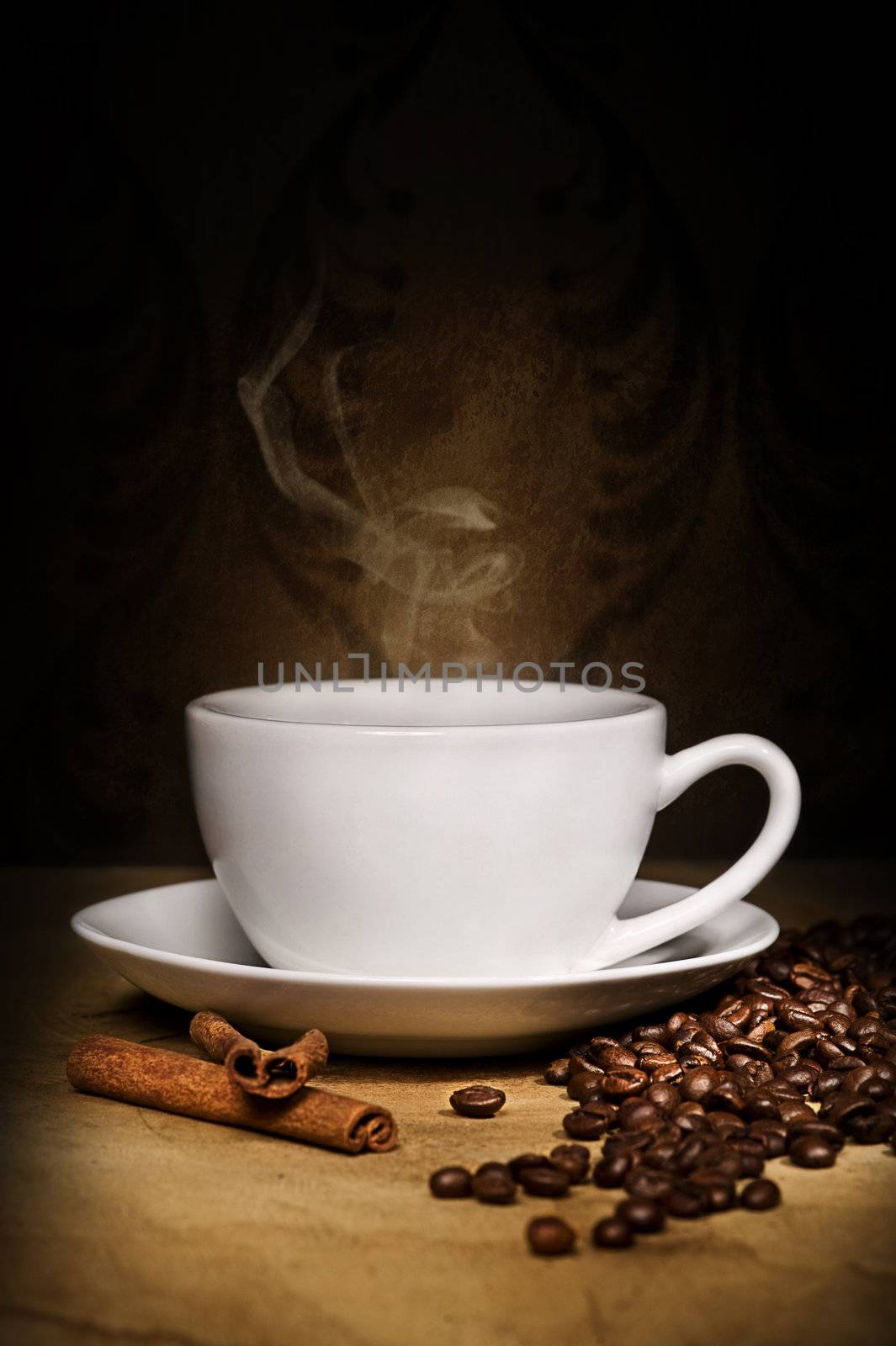 hot cup of coffee, bean and aromatic cinnamon