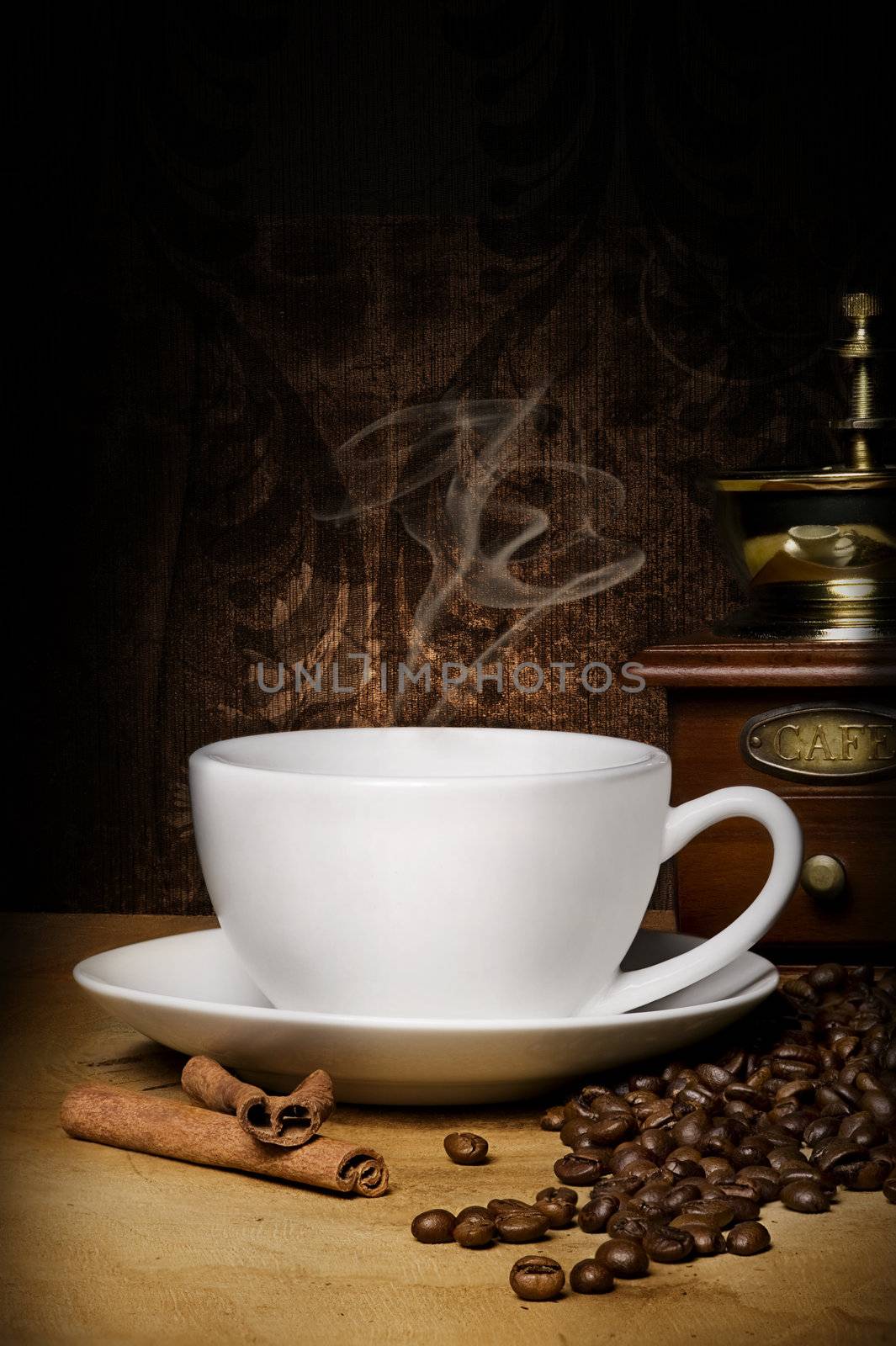 hot cup of coffee, winnower, grains and aromatic cinnamon