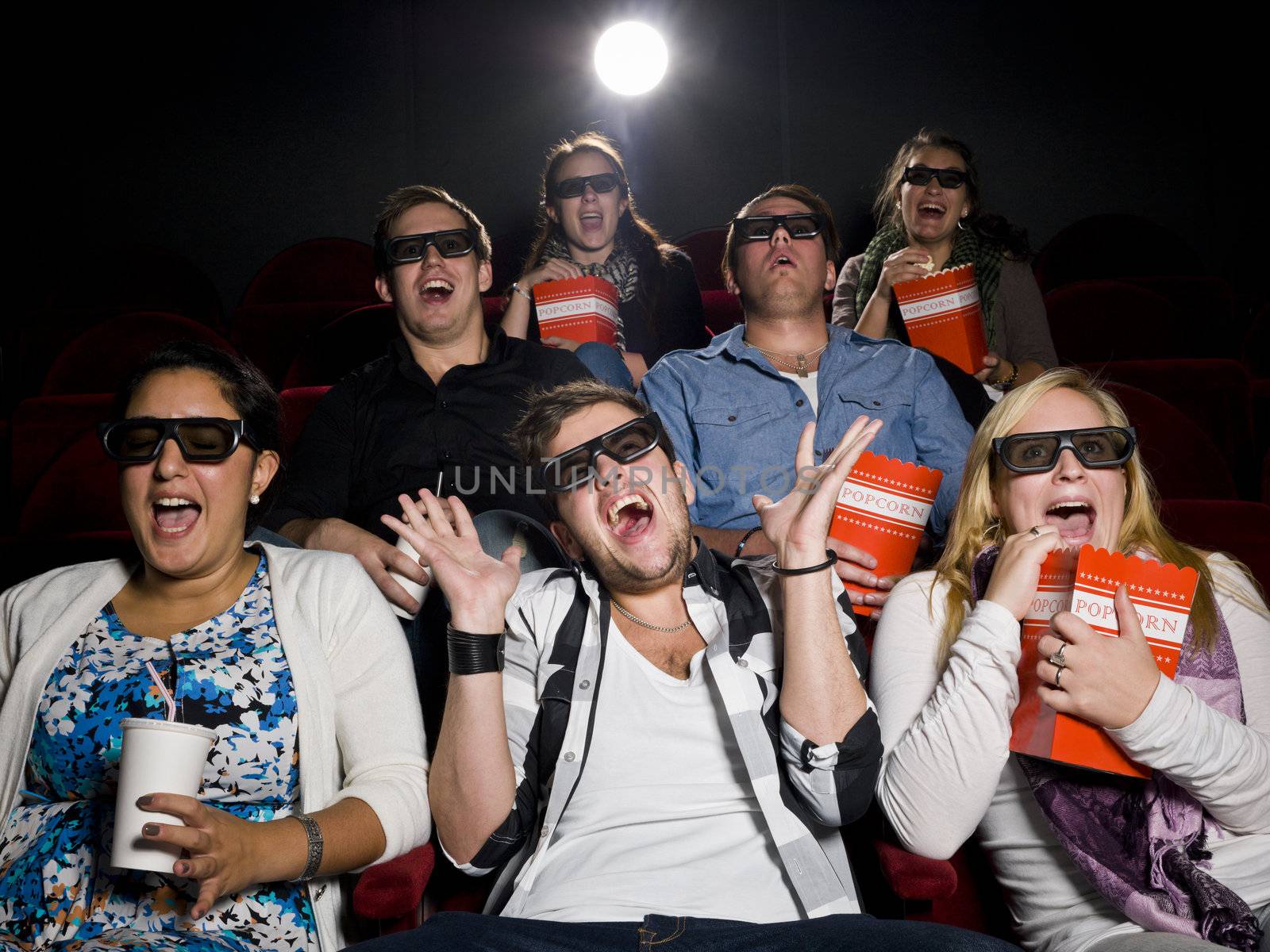 Scared Movie spectators with 3d glasses