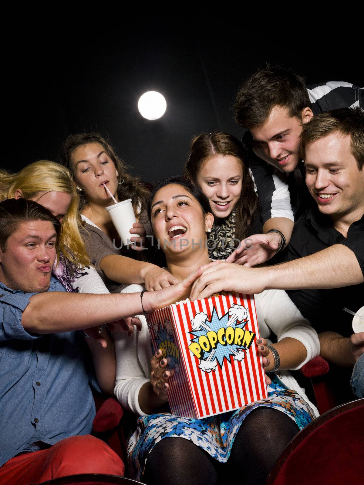 People eating popcorn by gemenacom