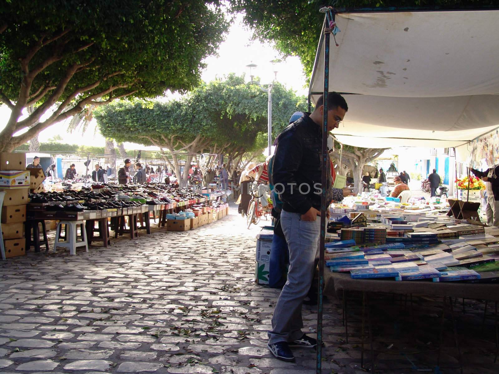 MADHIA, TUNISIA - DECEMBER 12: People at typical traditional tunisian street market in Madhia. December 12, 2010 in Madhia, Tunisia.