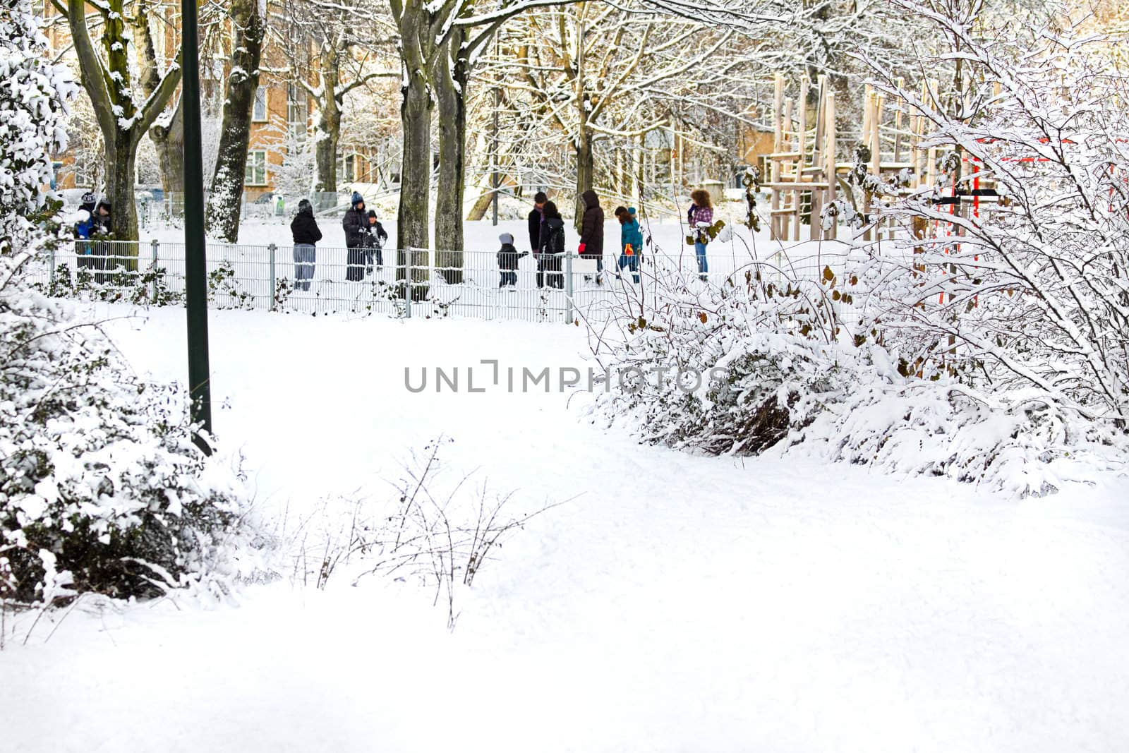 City in the snow - children playing in the park