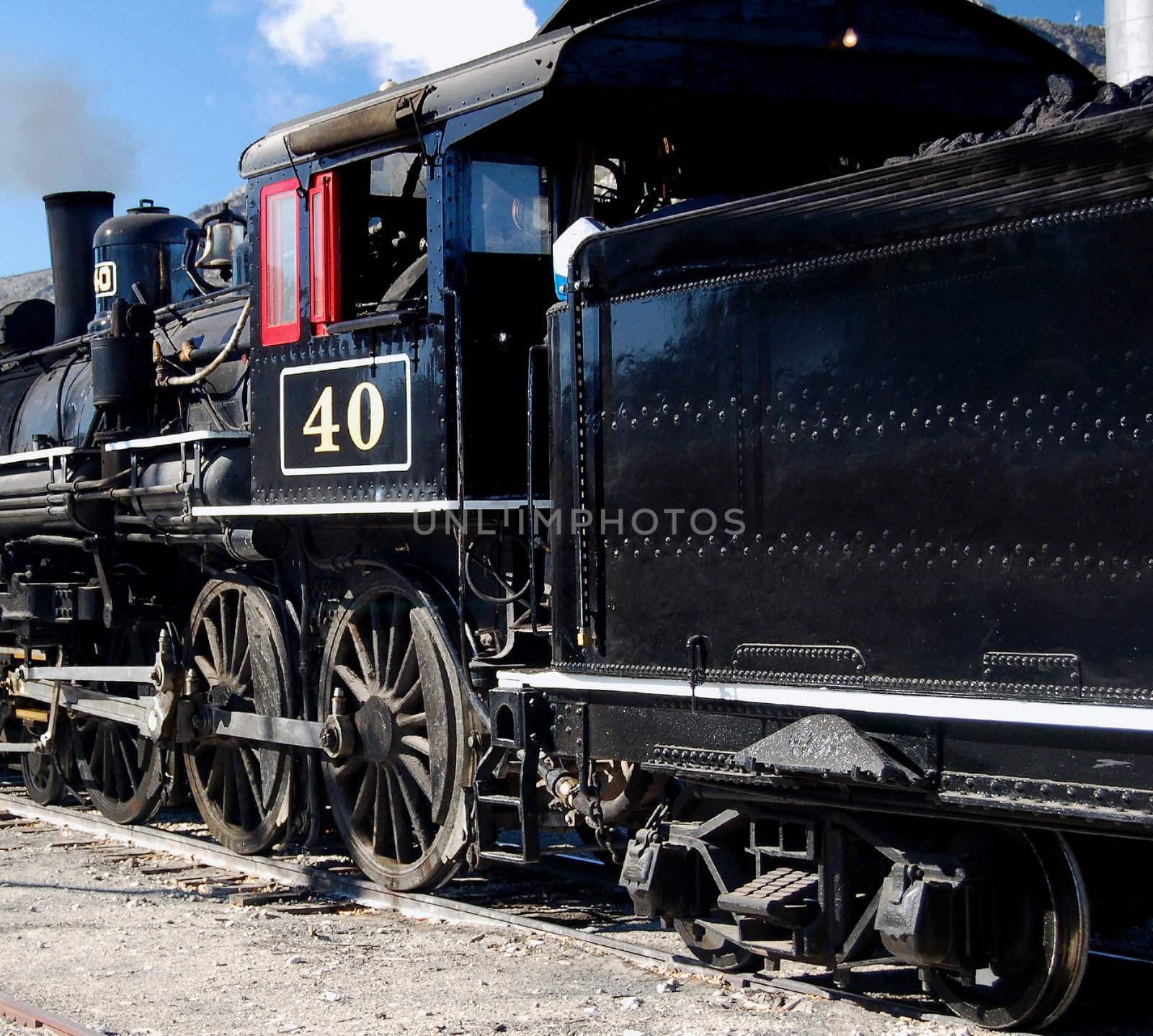 close up of steam engine locomotive and tender