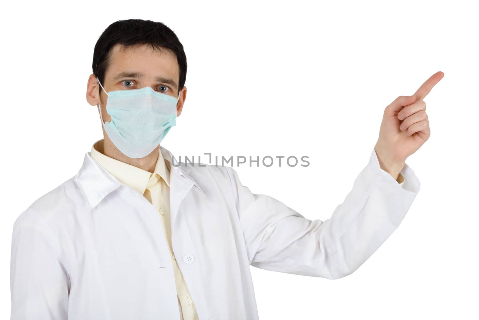 The young man in a medical mask points a finger