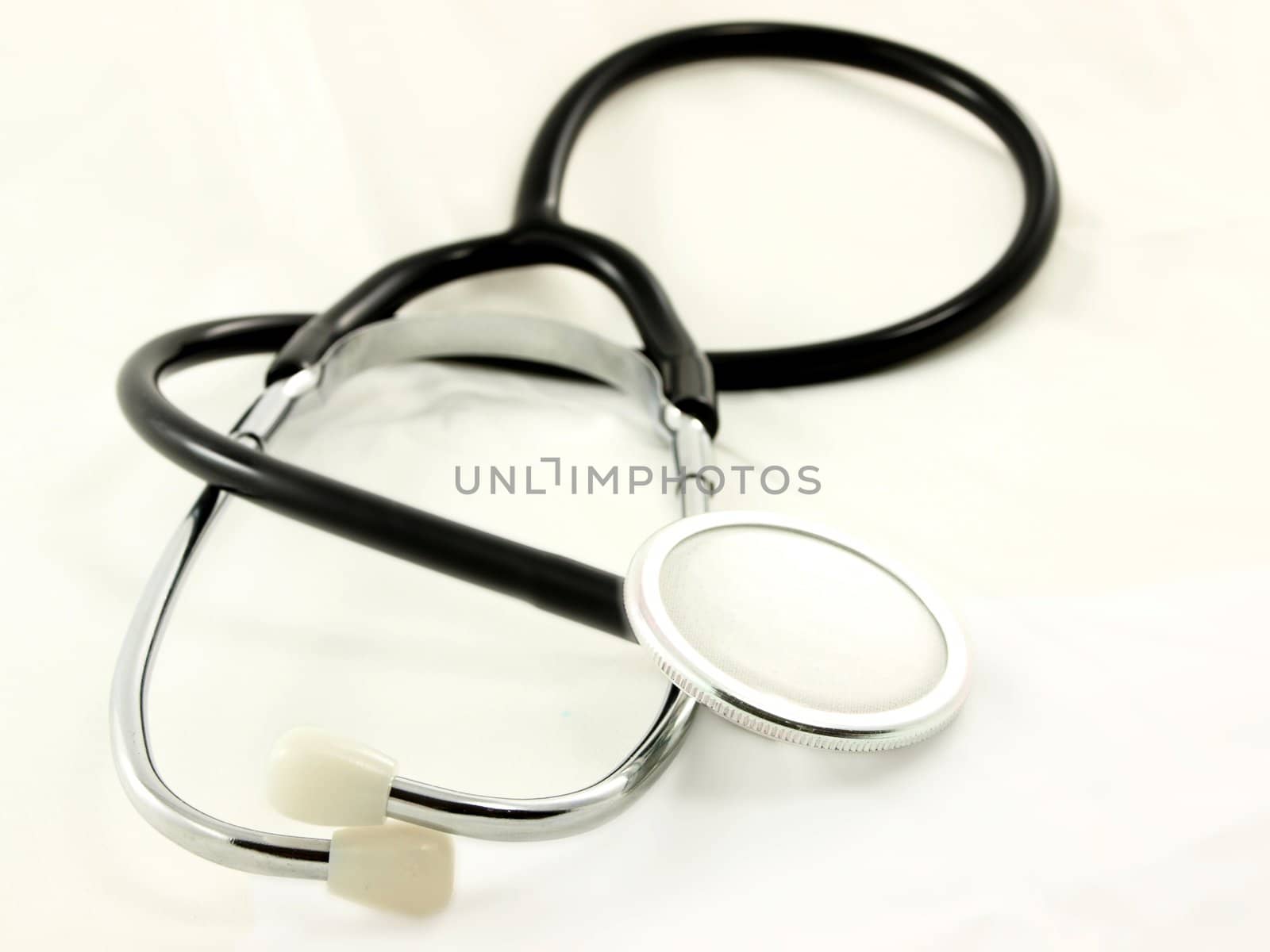 Stetoscope, isolated onto white sheet, towards white background