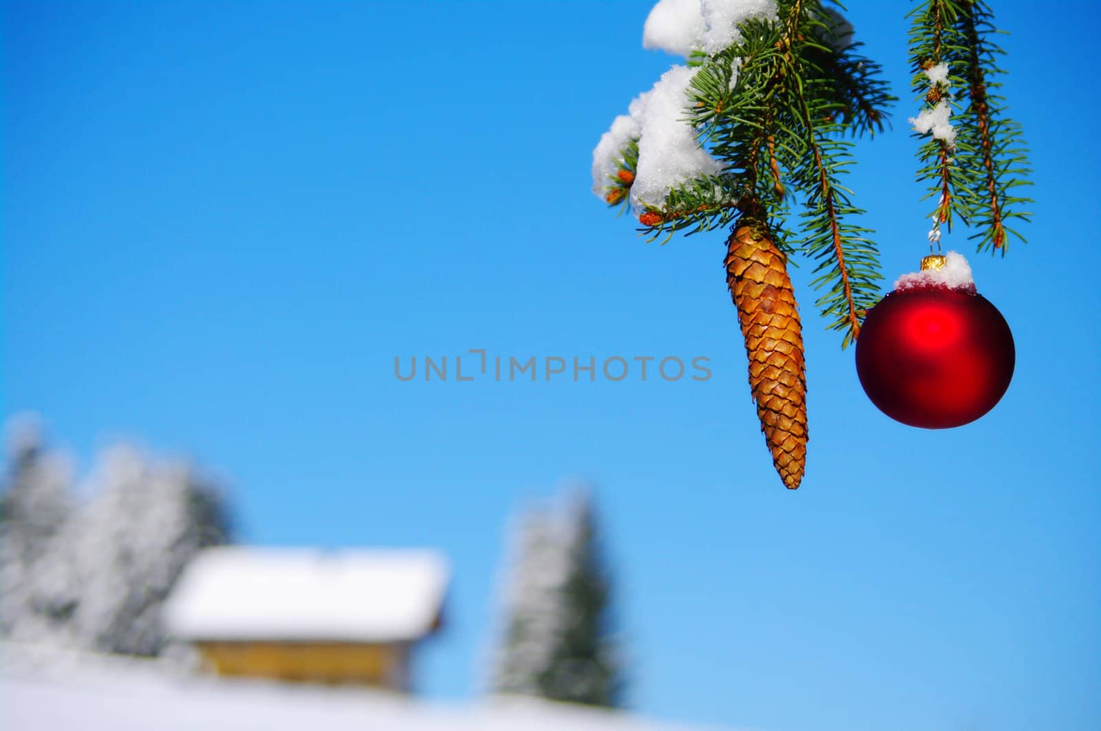 red bauble christmas ball ornament outside in a snowy winter scene