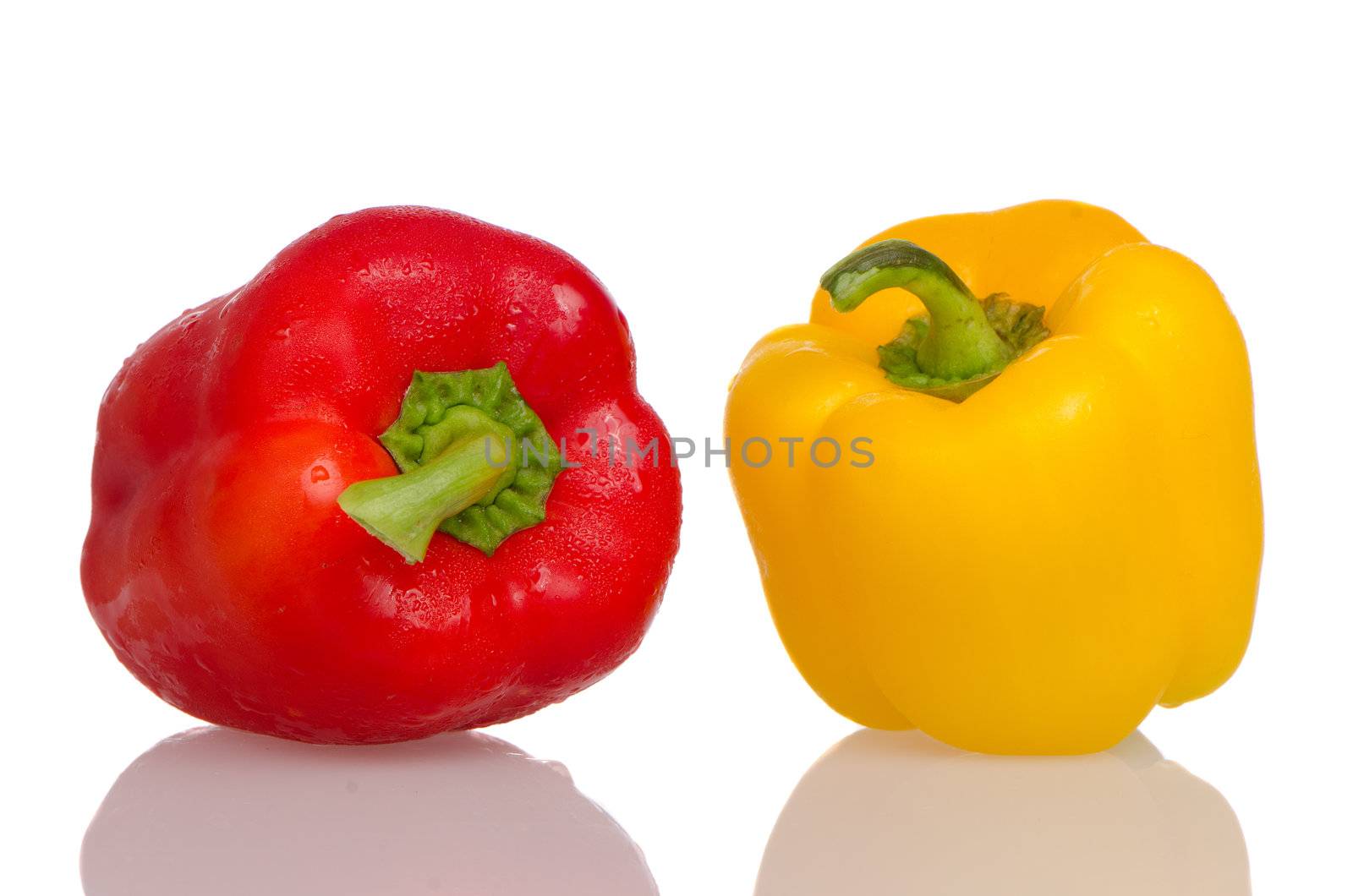 Two fresh peppers on white background.