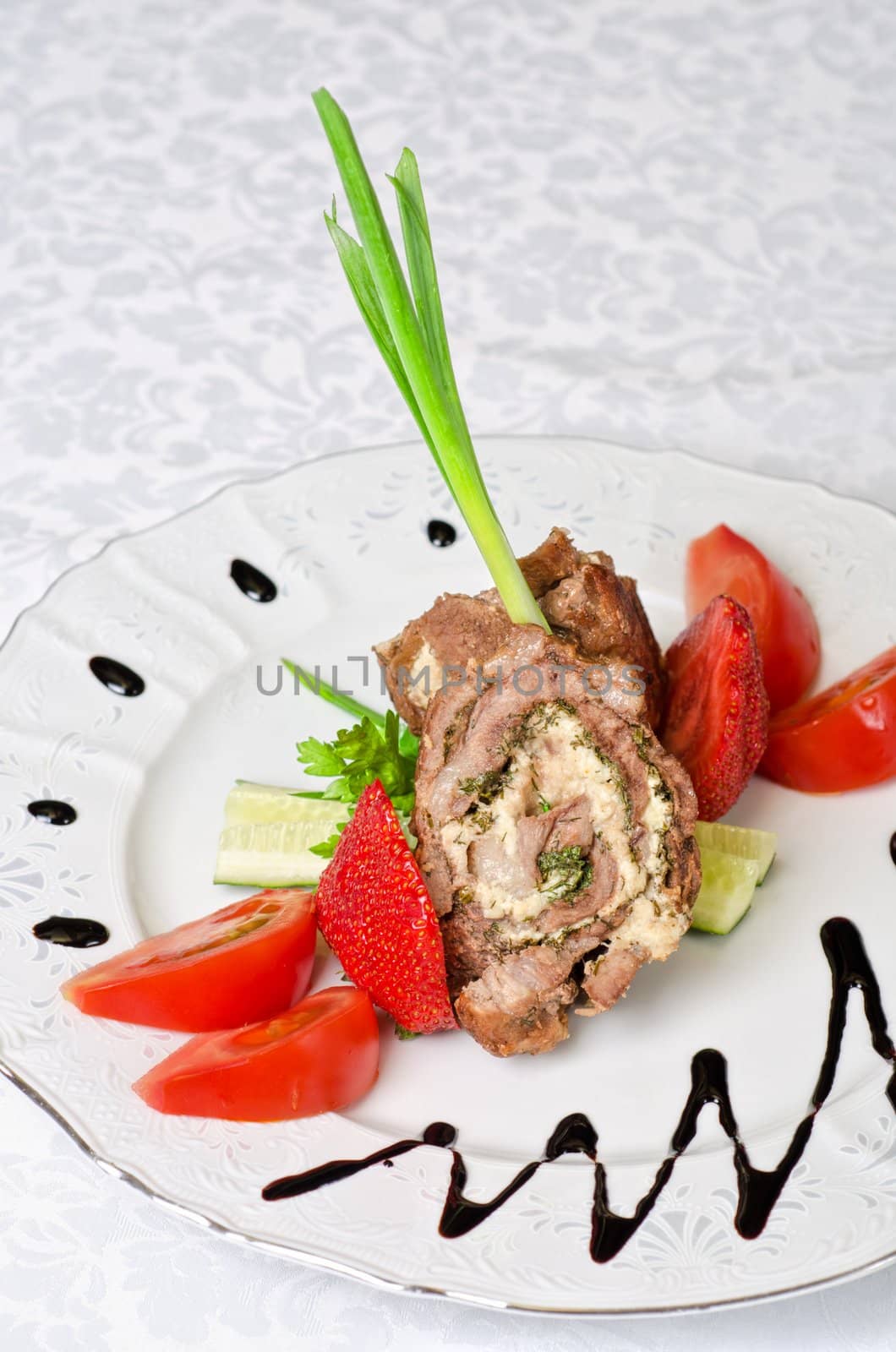 Pork rolls with cheese and vegetables: onion, cucumbers, tomatoes