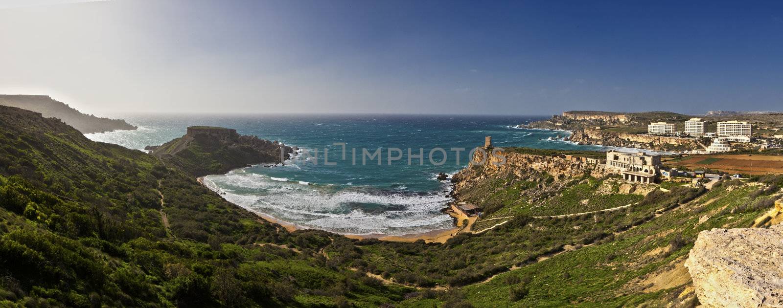 Panoramic view of Ghajn Tuffieha Bay.  One of the most beautiful and idyllic beaches on the island of Malta,it is surrounded by unique scenery and is an area of high ecological importance