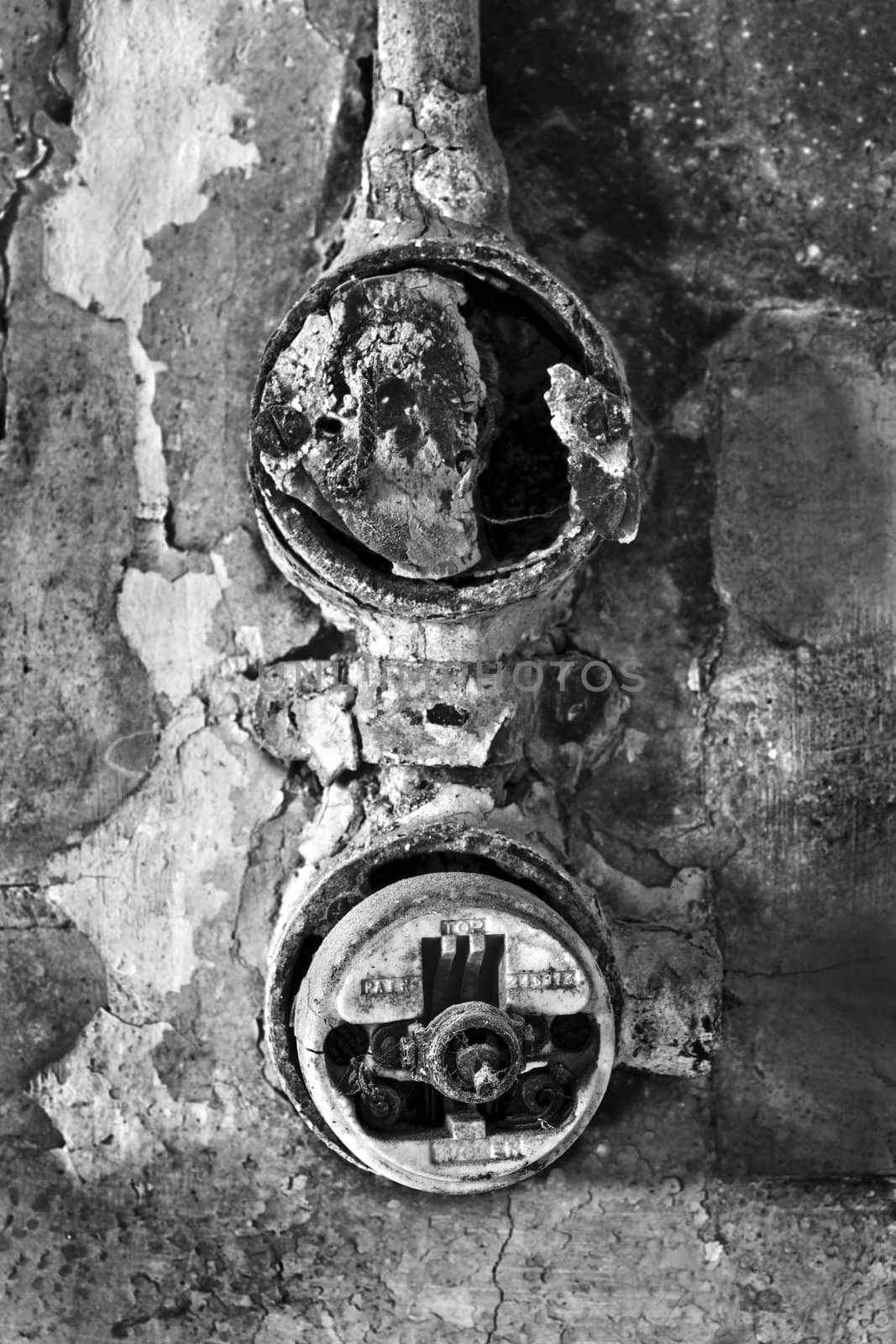 Detail monochrome shot of an old electrical light switch