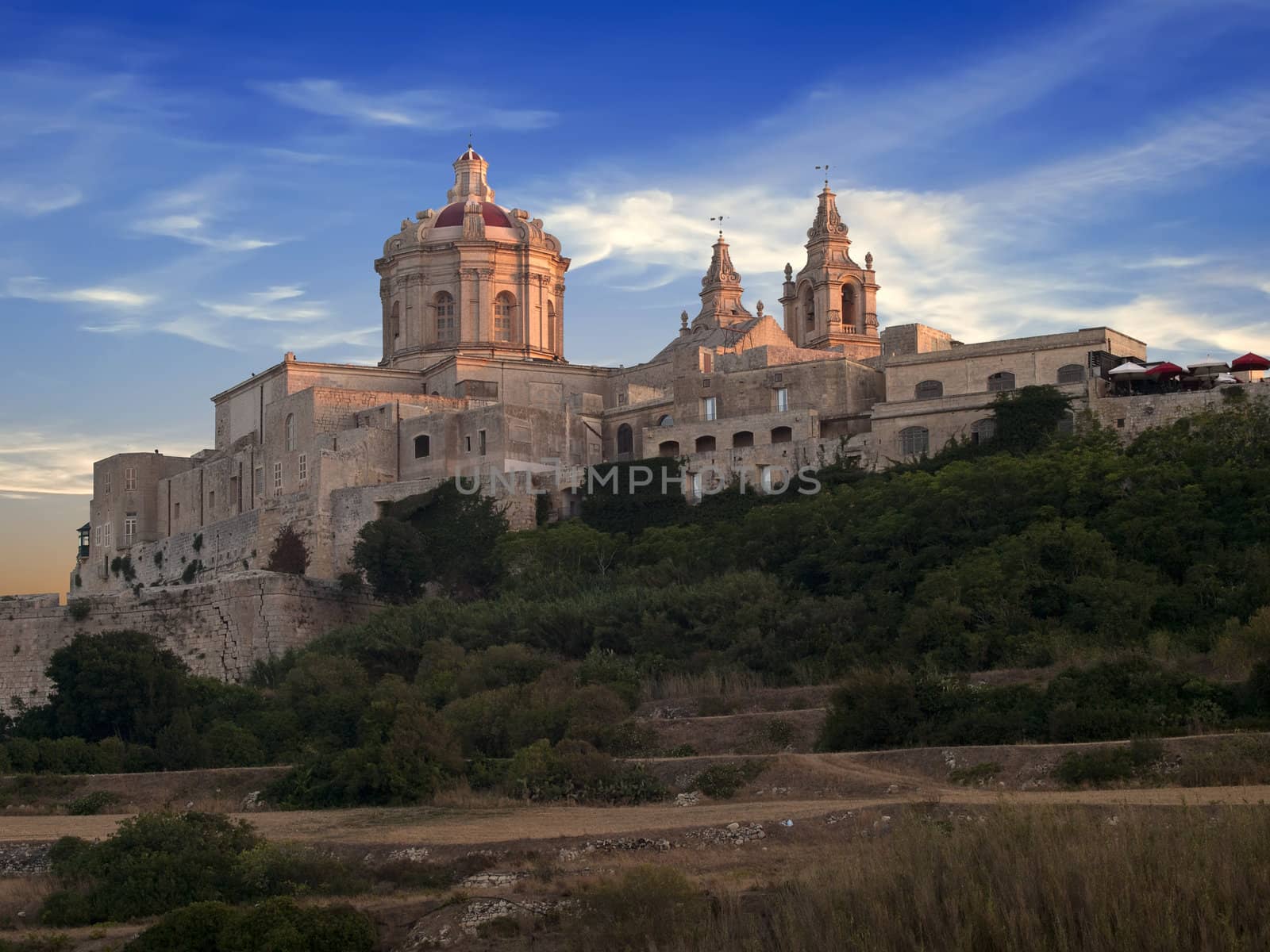 The beautiful city of Mdina gently kissed by the last rays of the sun on a summer's day