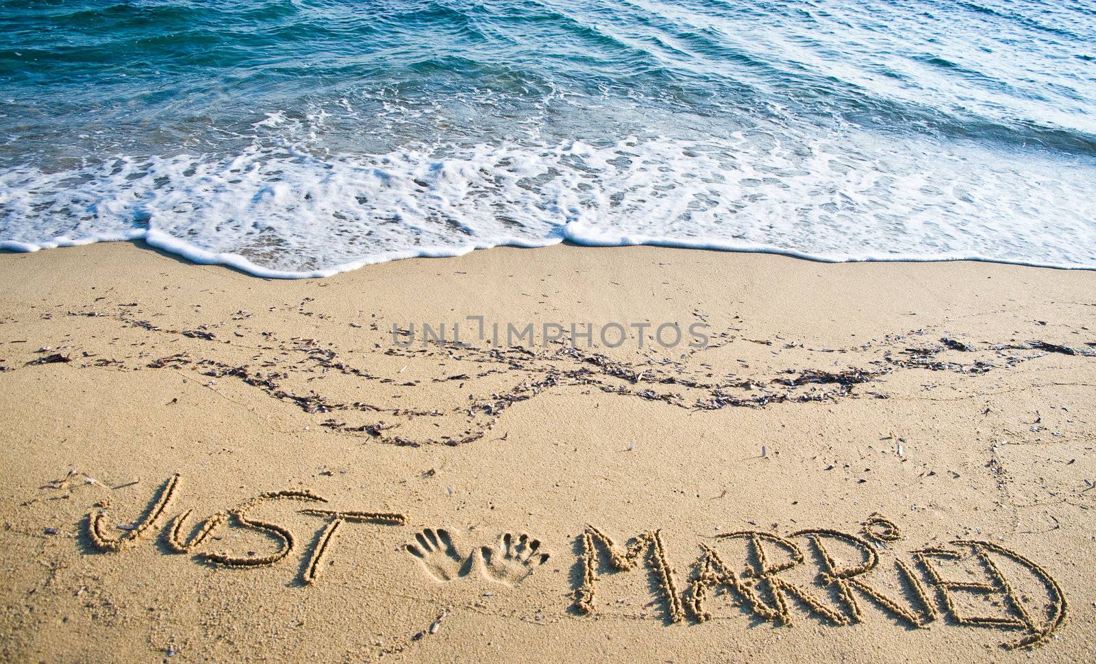 Just Married written in the Sand on the Beach