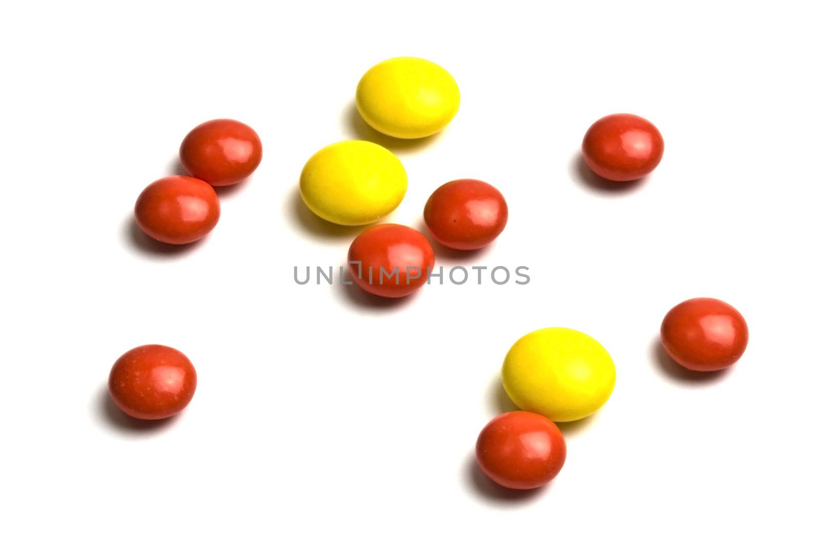 Red and yellow pills isolated on white background