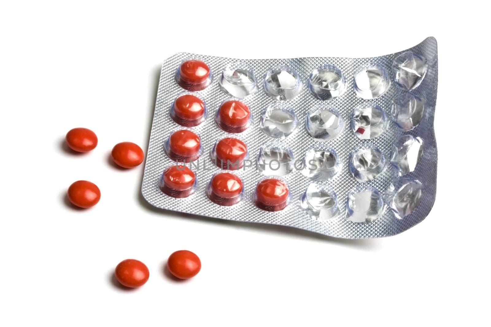 Rows of red pills isolated on white background