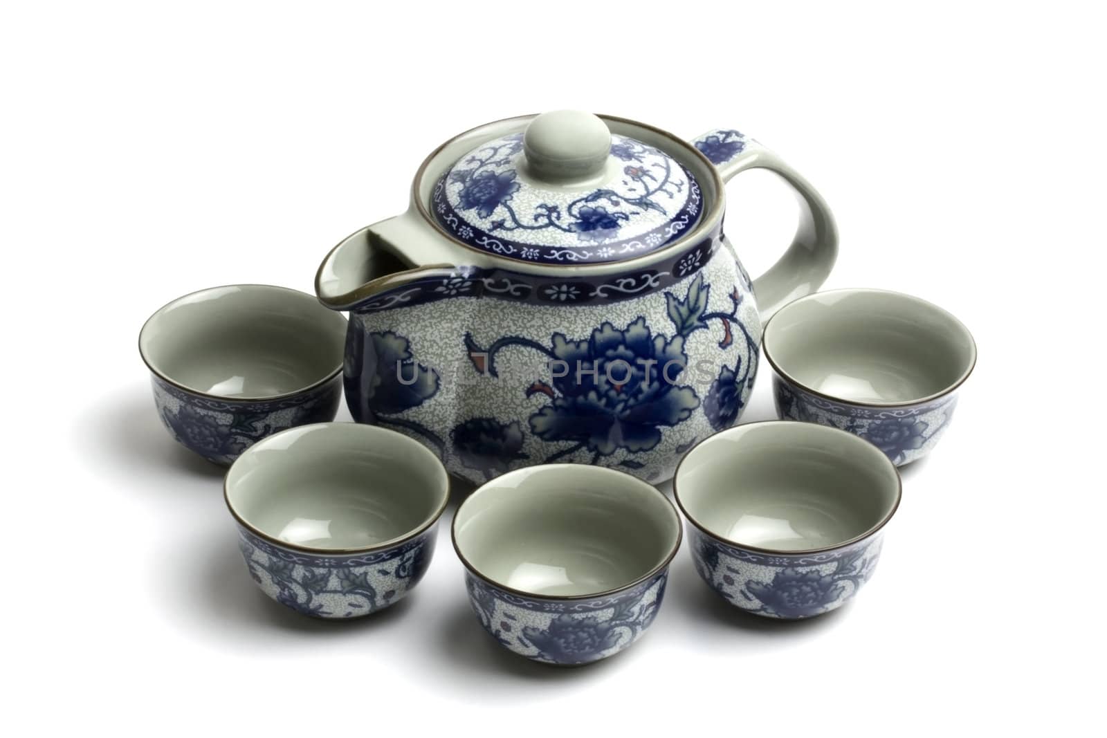 Chinese tea set with cups and tea pot isolated on white