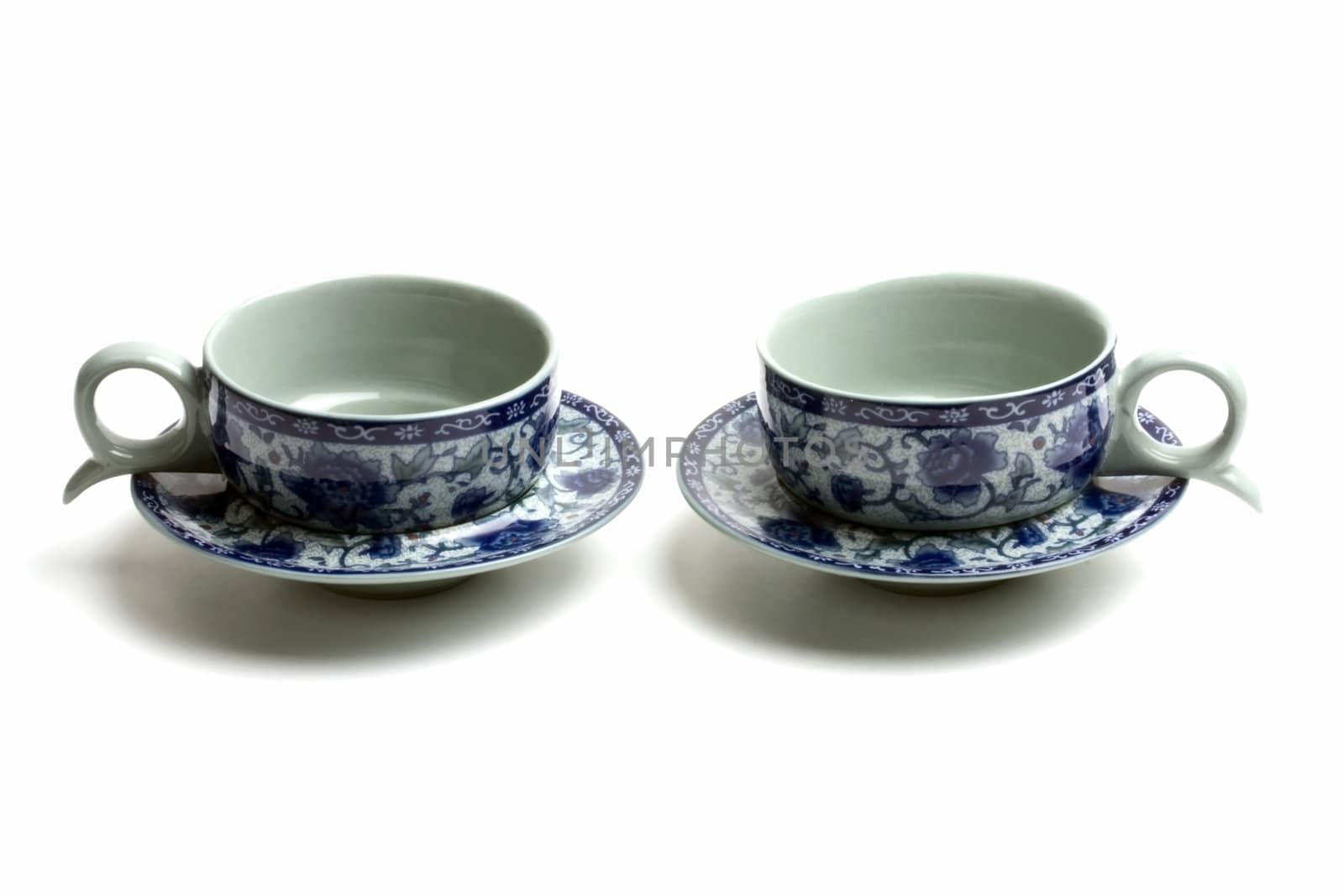 A pair of tea cups isolated on white background