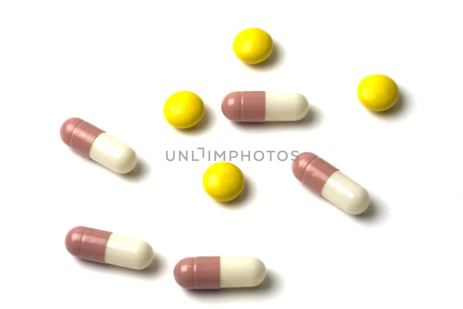 Colourful pills isolated on white background