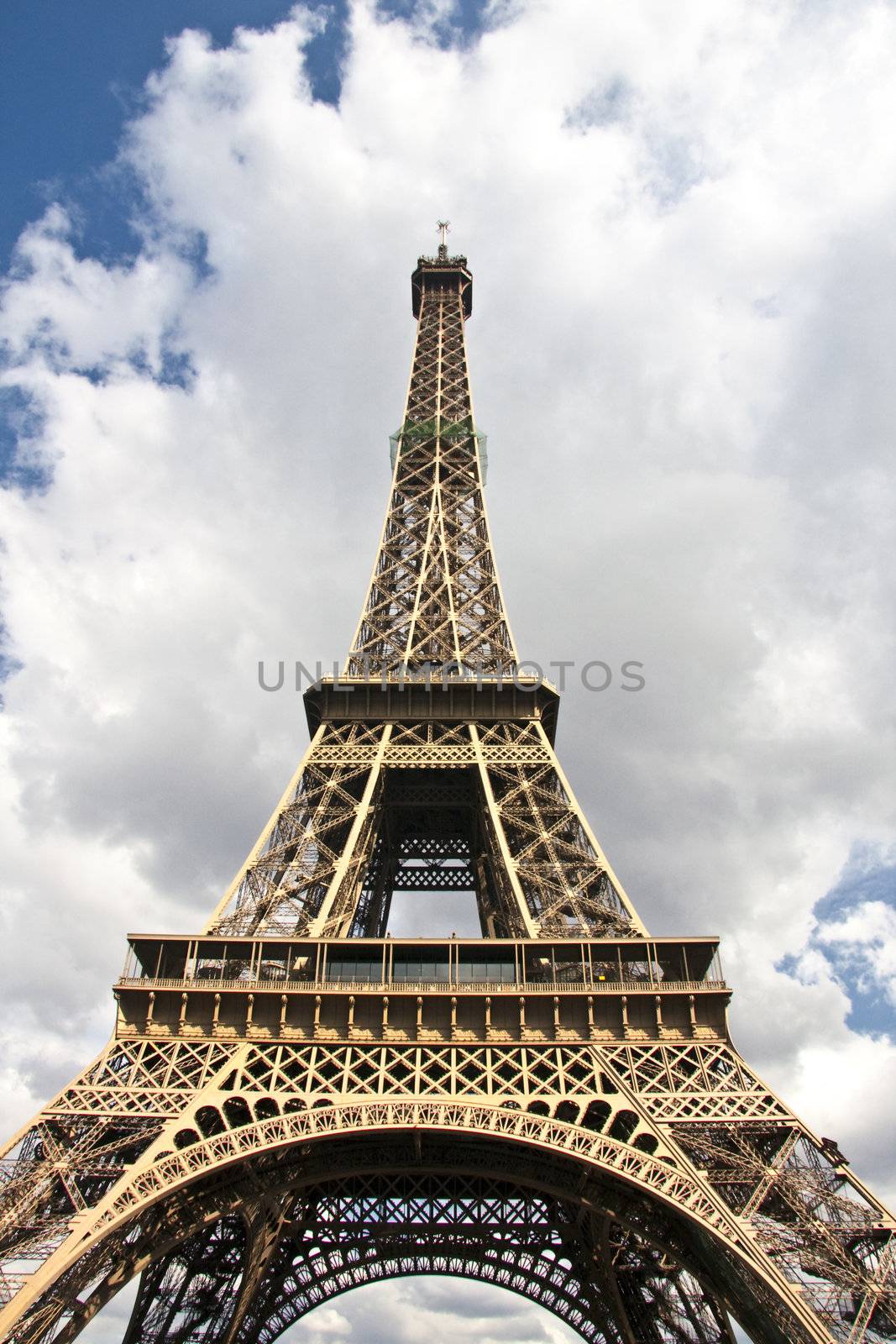 Closeup Eiffel tower in cloudy sky ,Paris ,France 
