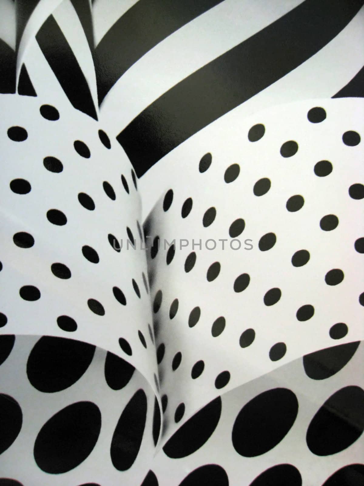 Closeup black striped and polka dot background