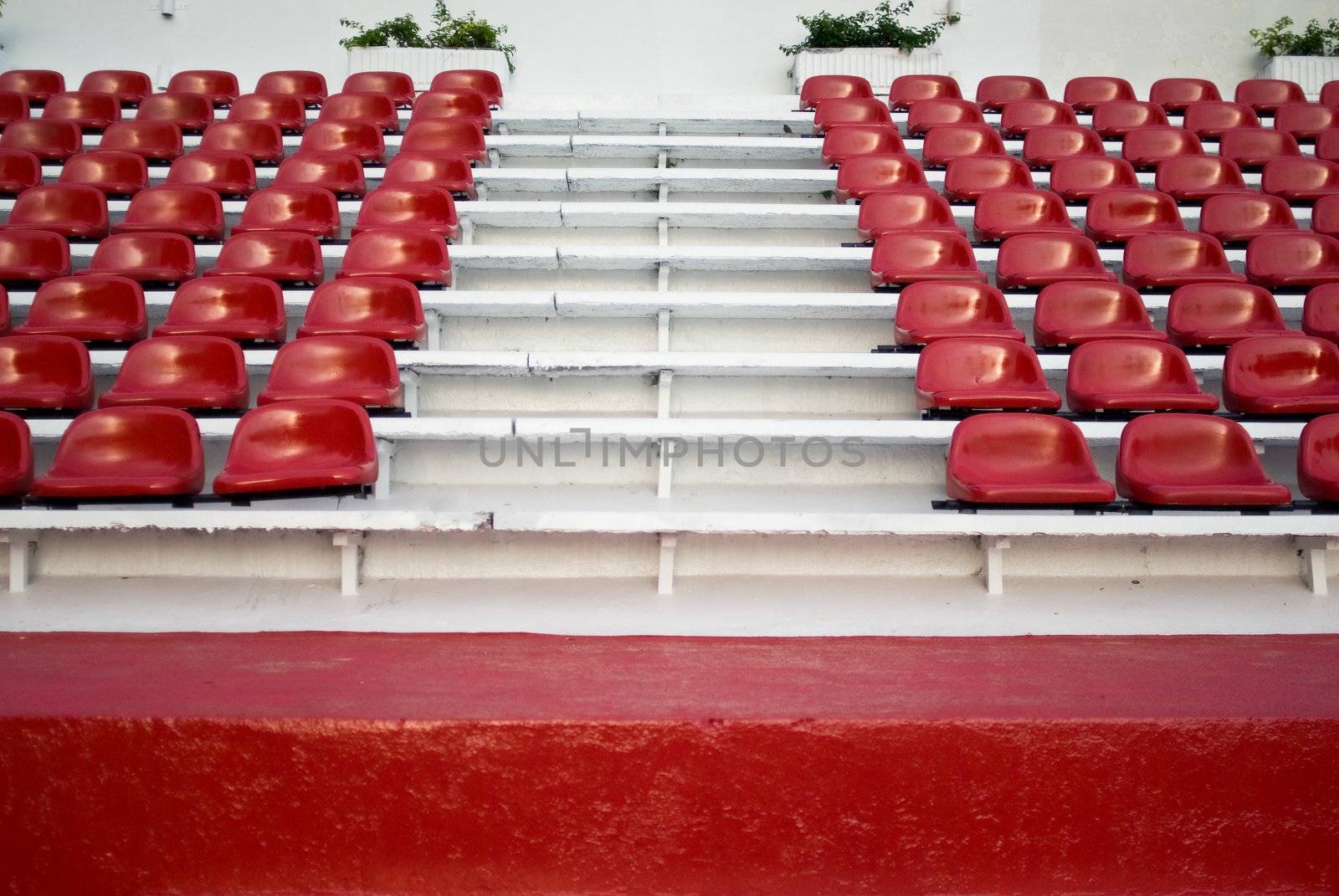 Red bleachers in areana, Thailand.