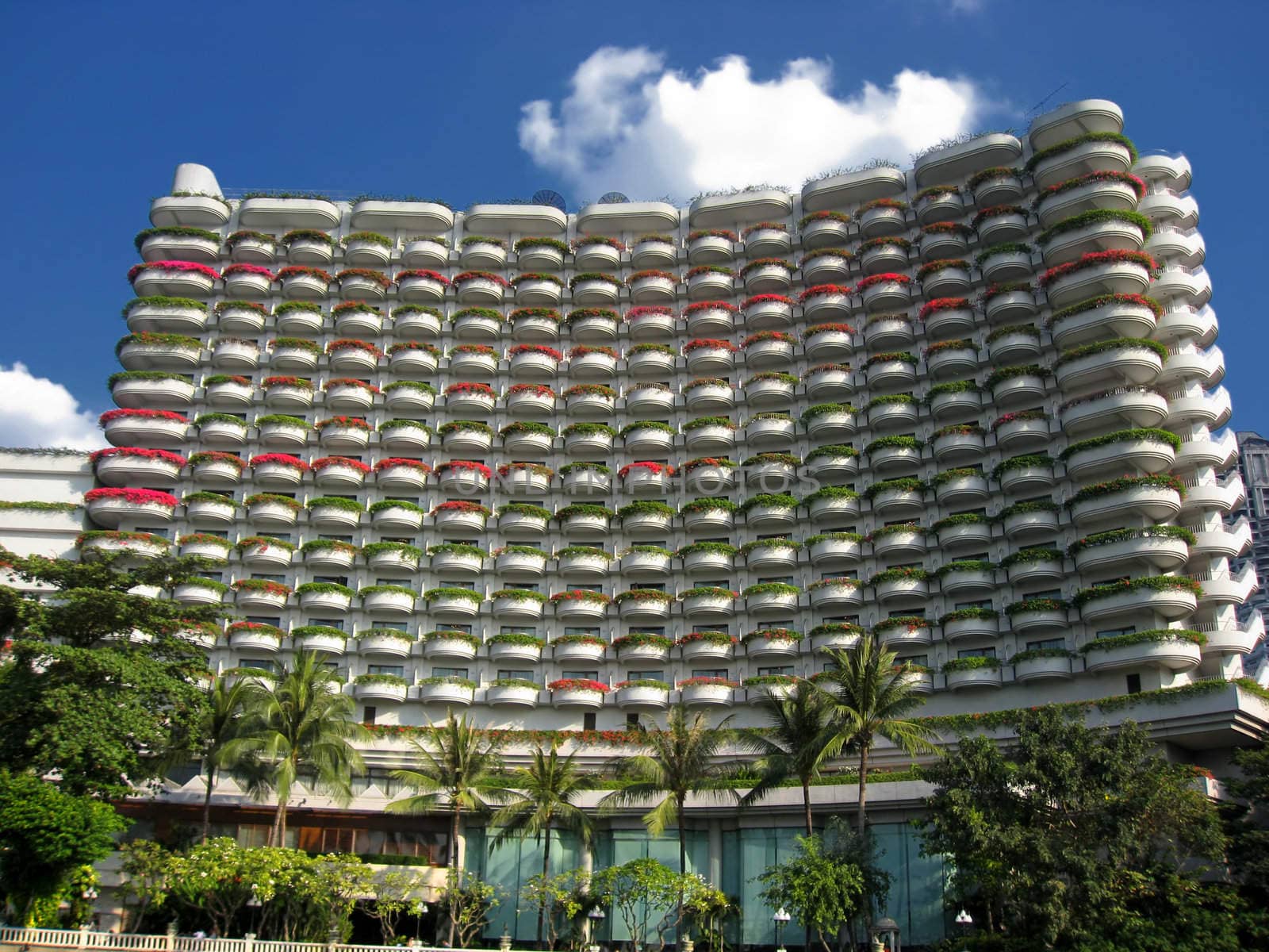 Hotel building in Bangkok. Nice balcony composed by beautiful flowers. 