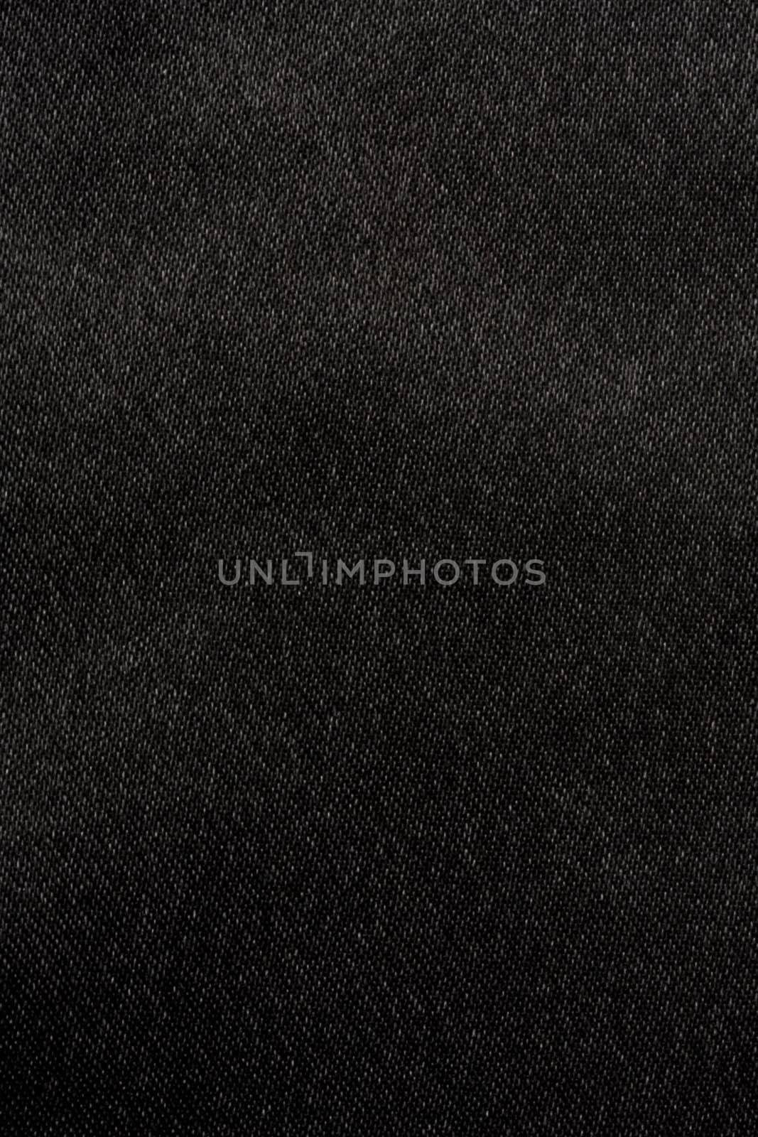 Black satin fabric background closeup. 

