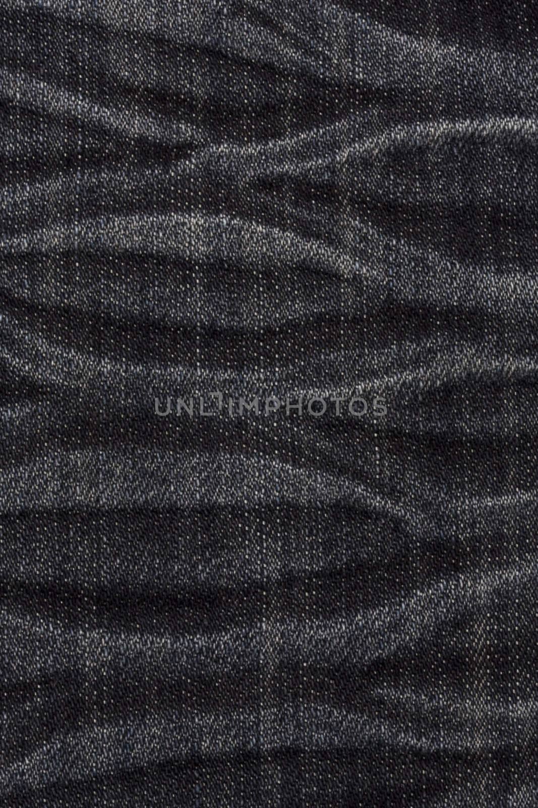 Texture of black jeans background closeup