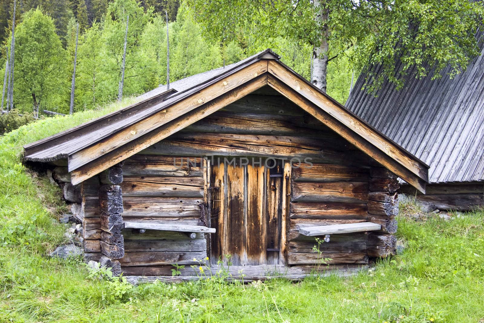 Old traditional wooden cabin in Sweden 
