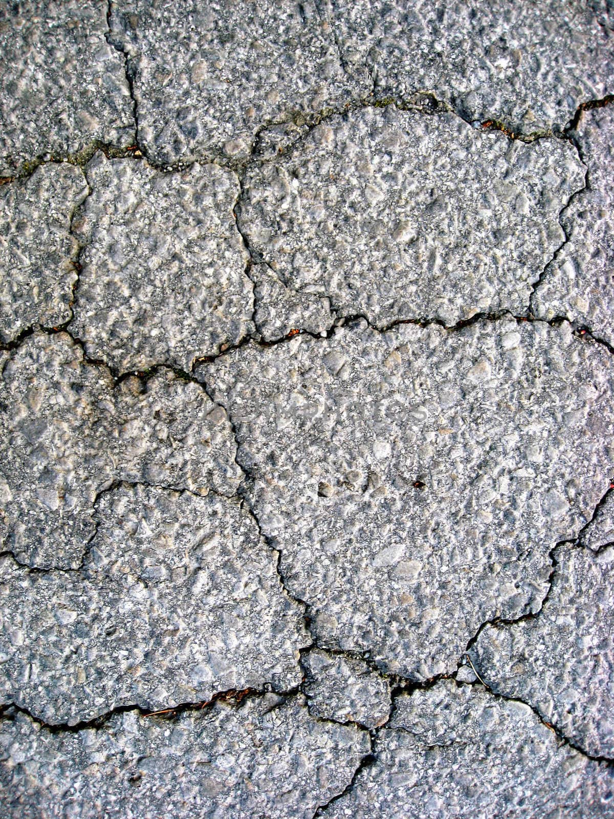 Cracks on asphalt background