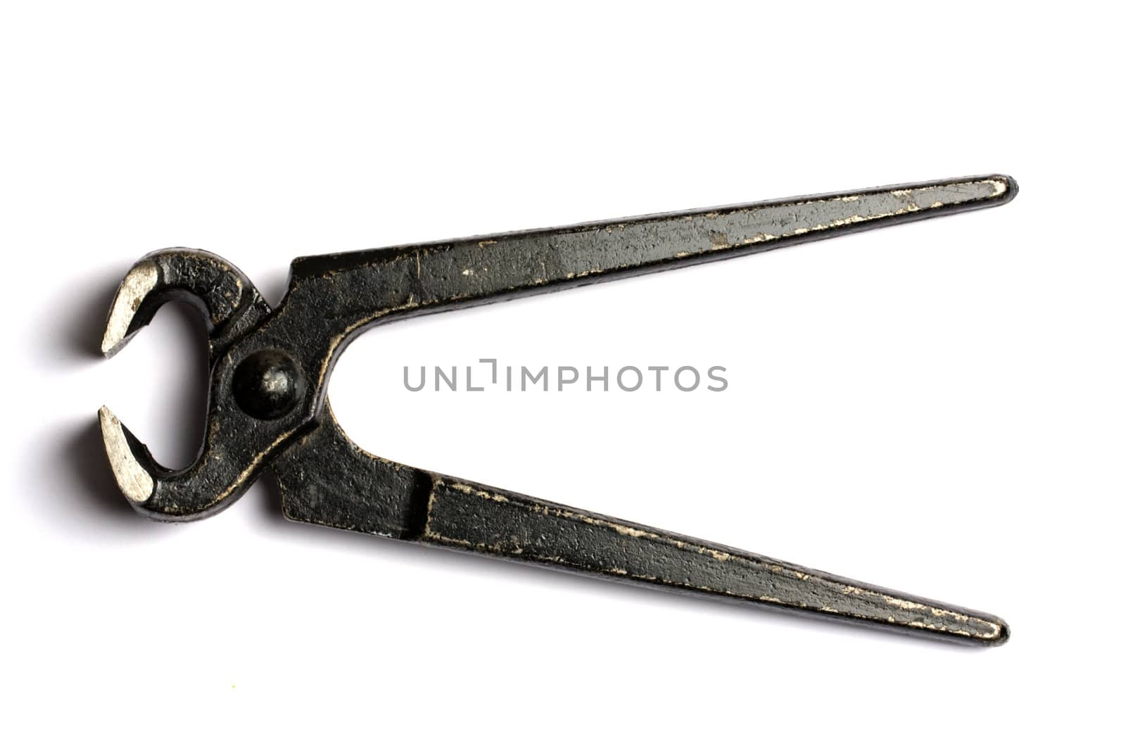 Old black tongs isolated on white background
