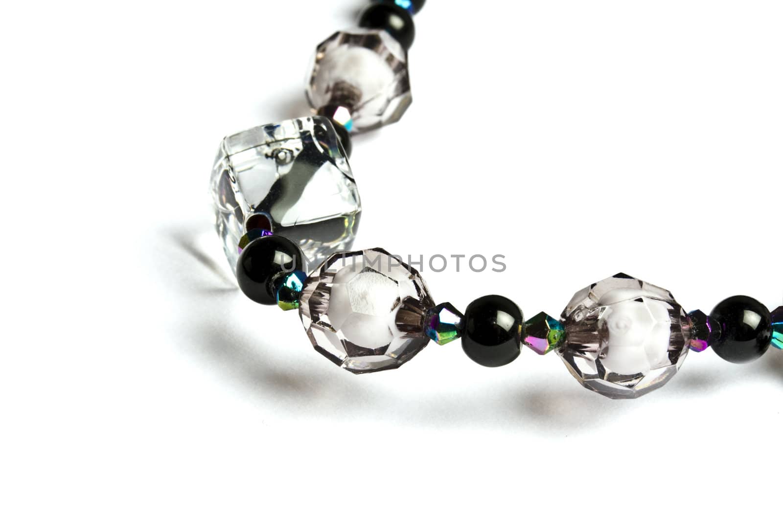 string of beads closeup on white background 