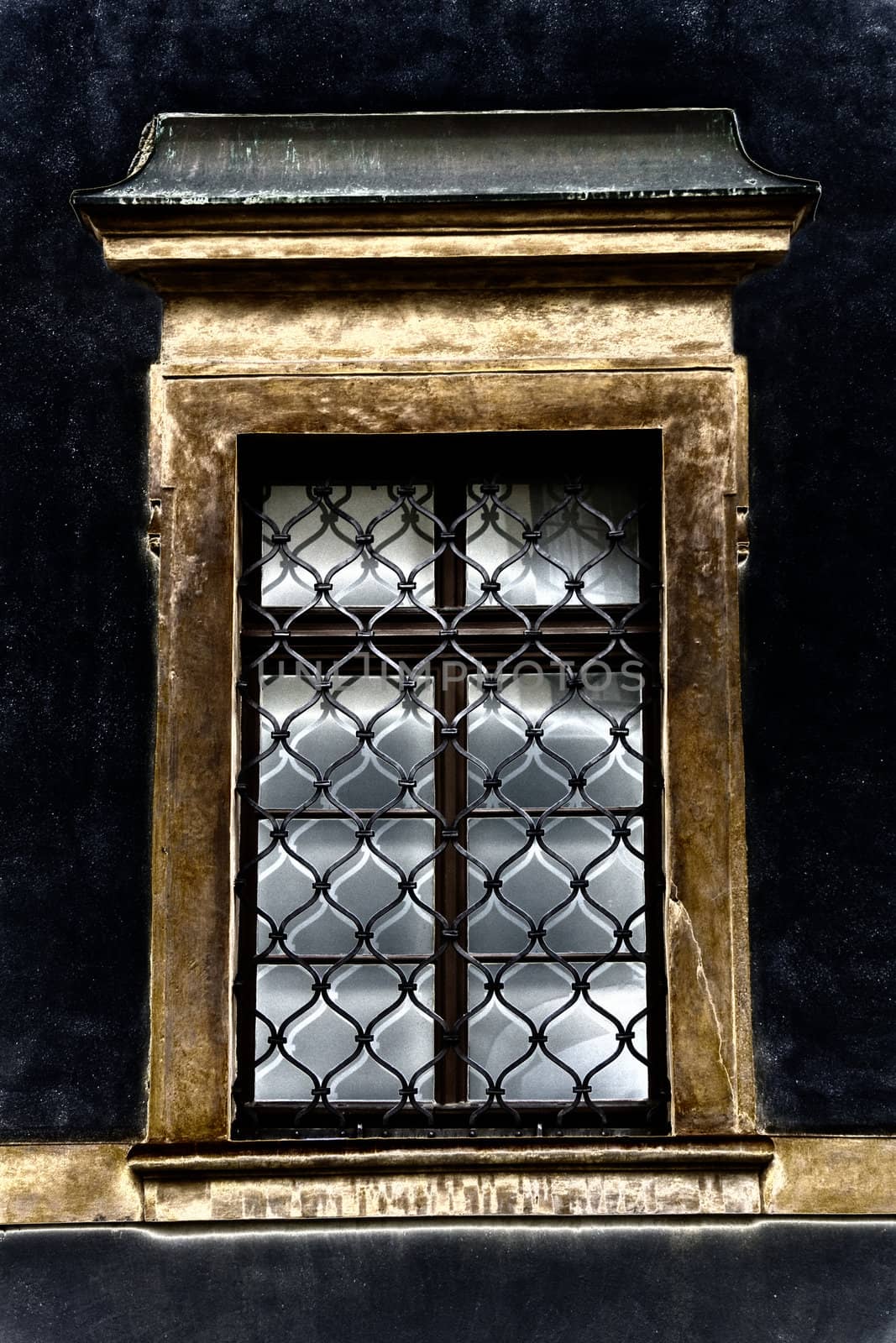 Ond window of old building closeup in Prague
