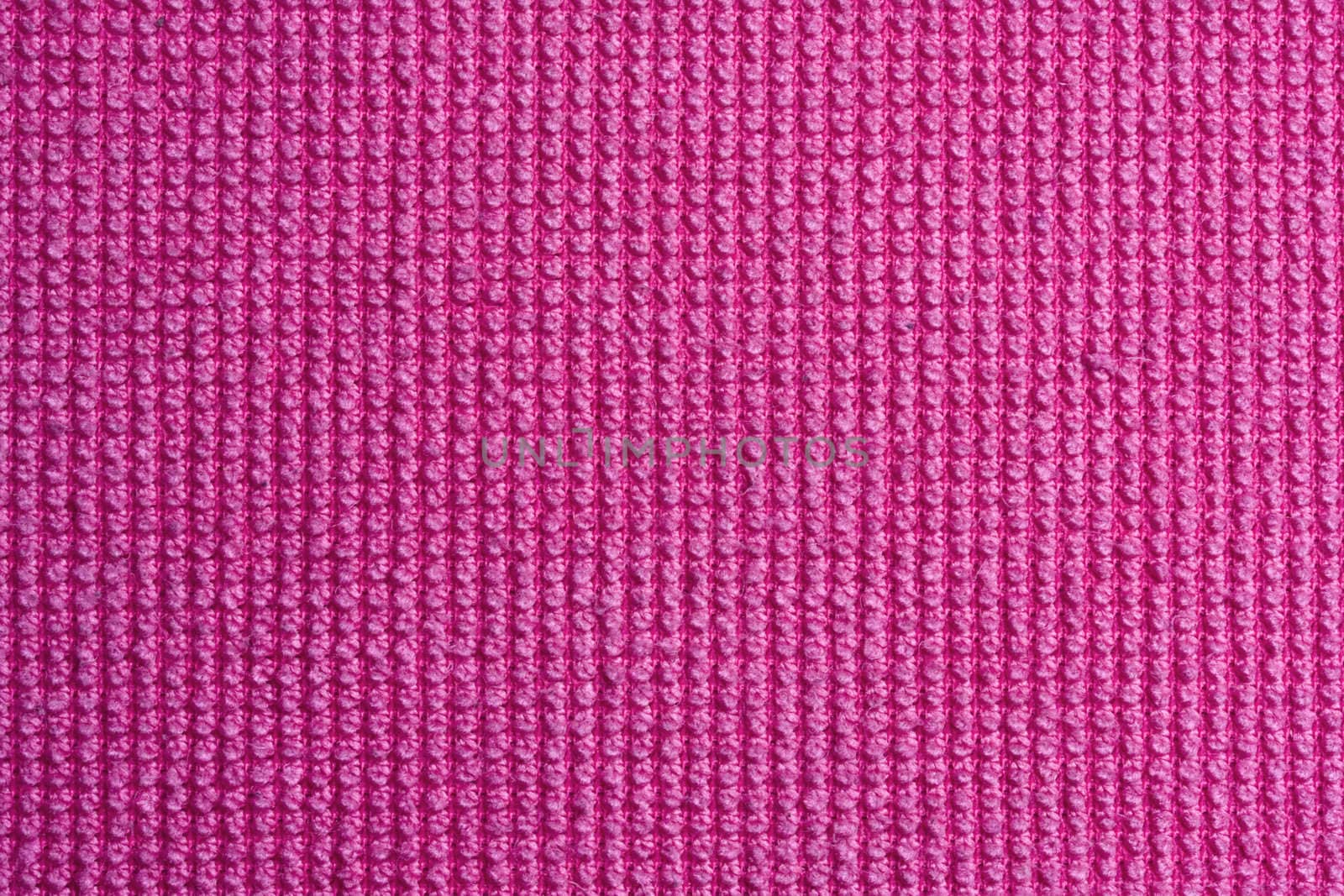 Texture of pink fabric background closeup 