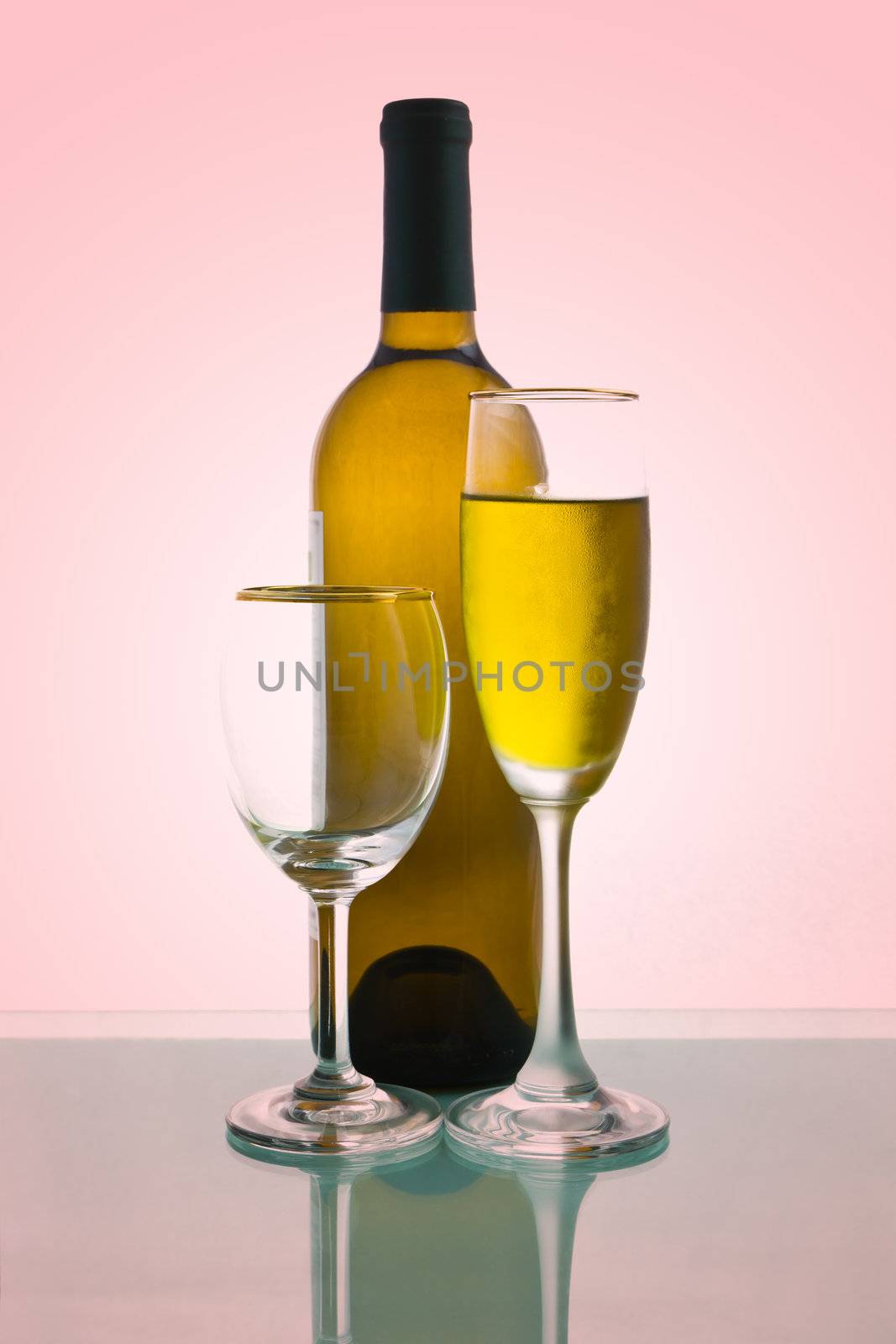 Bottles and glasses of wine on red background