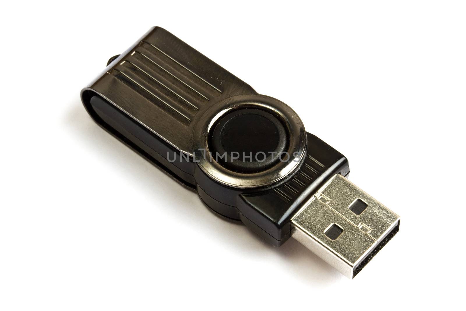 A black USB memory stick isolated on white background
