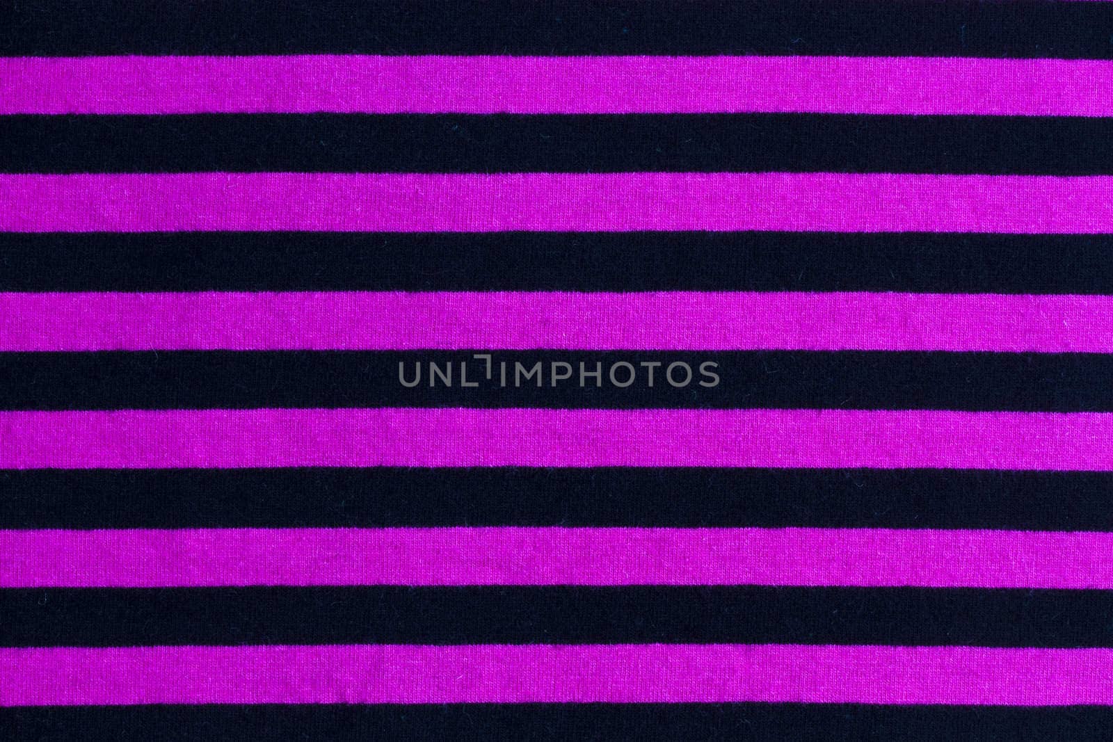 Texture of pink and black striped fabric background