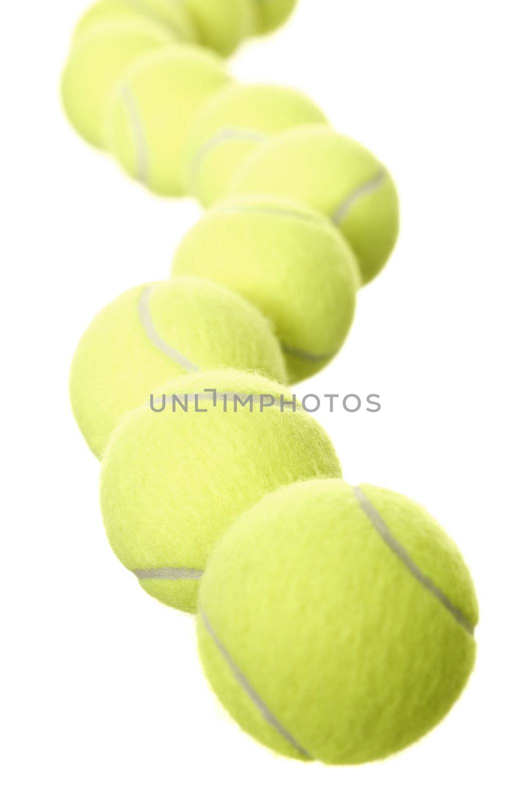 Group of Tennis balls in a row isolated on white background