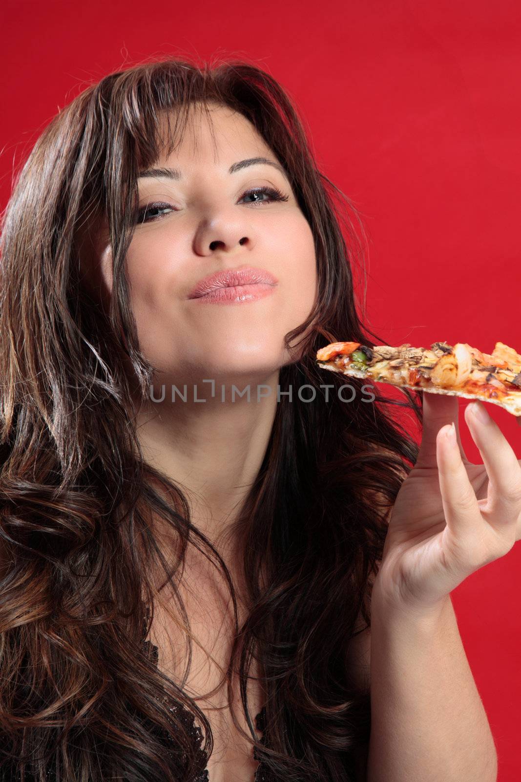 Mmmm woman enjoying pizza by lovleah