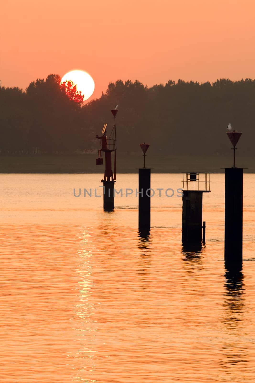 Orange sunset at the riverside by Colette