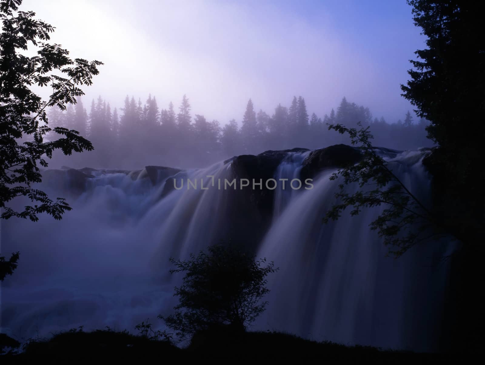 Beautiful waterfall in fog mountain 