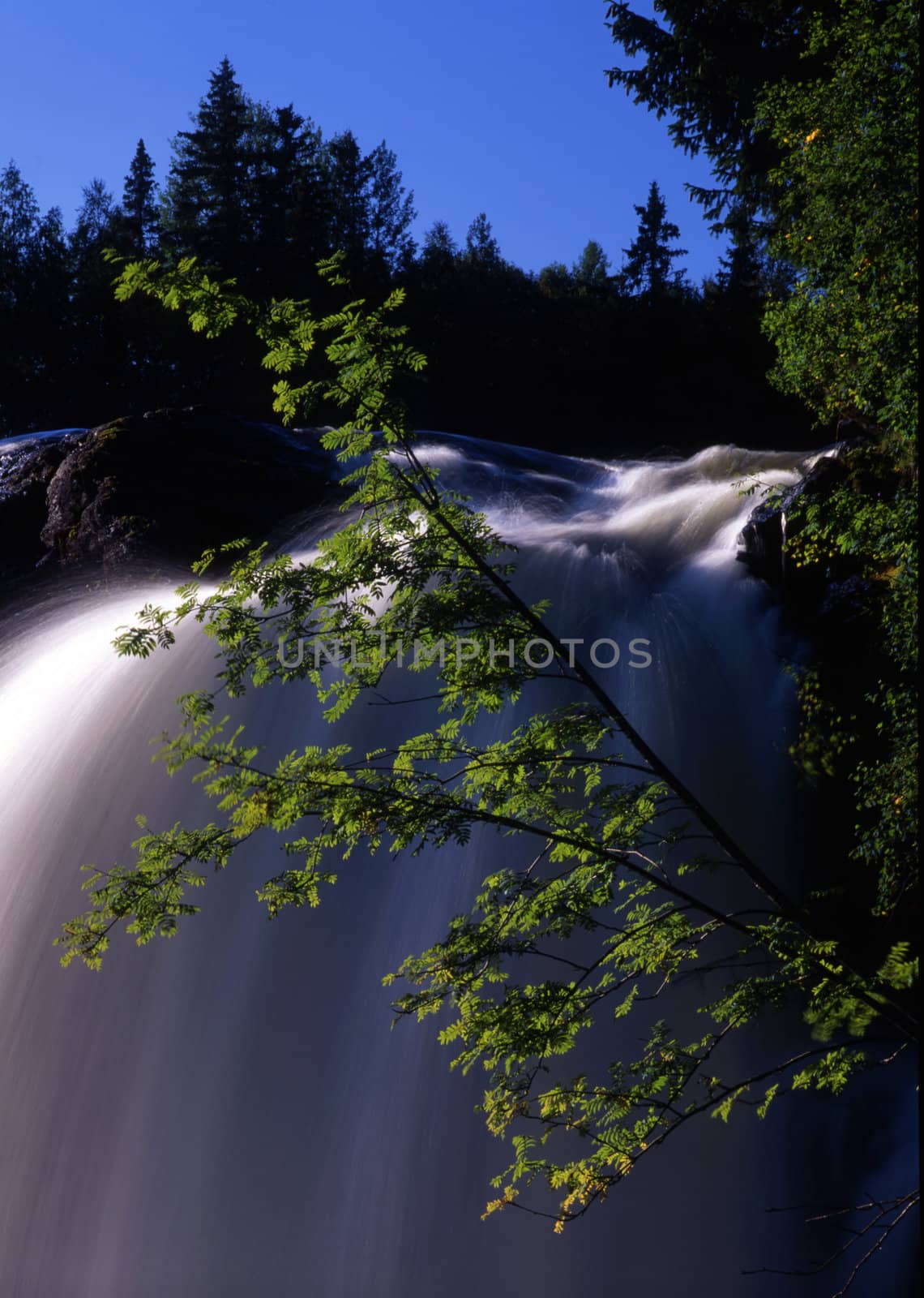 Beautiful waterfall in forest with blue sky 