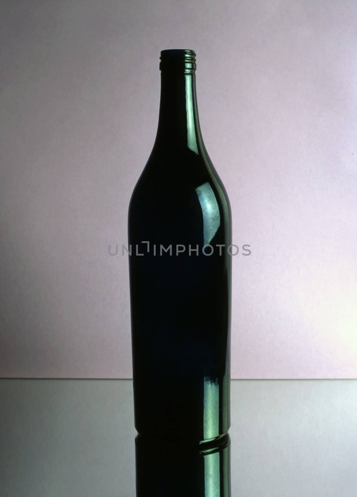 A empty wine bottle isolated on mirror
