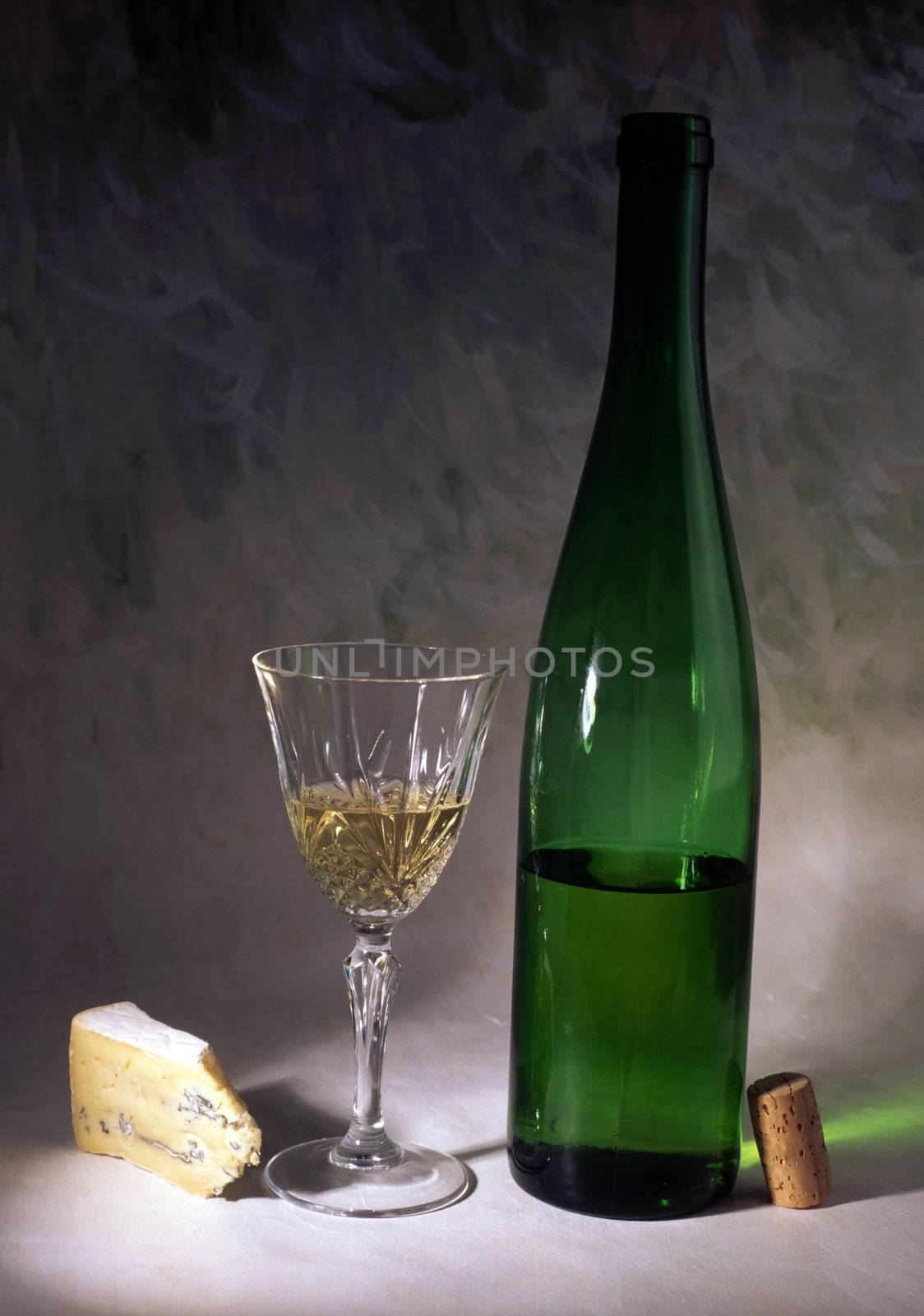 White wine and cheese isolated on painted background